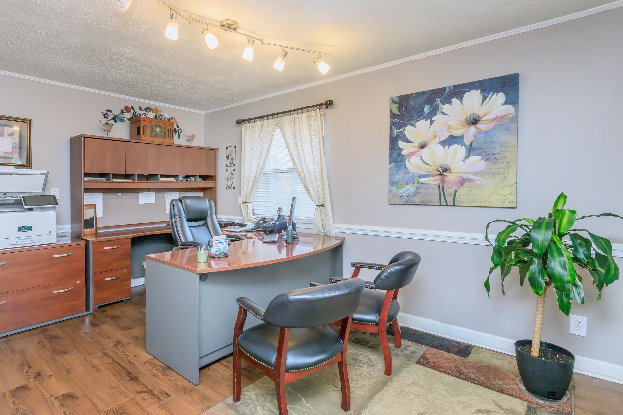 a living room filled with furniture and a flat screen tv