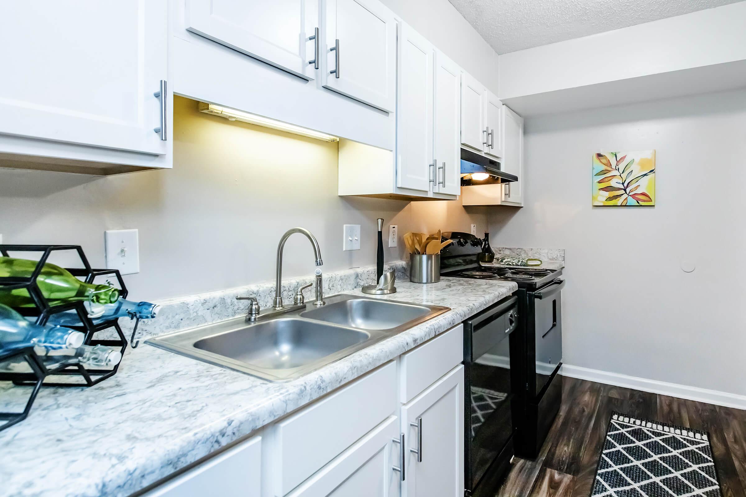 a kitchen with a stove and a sink