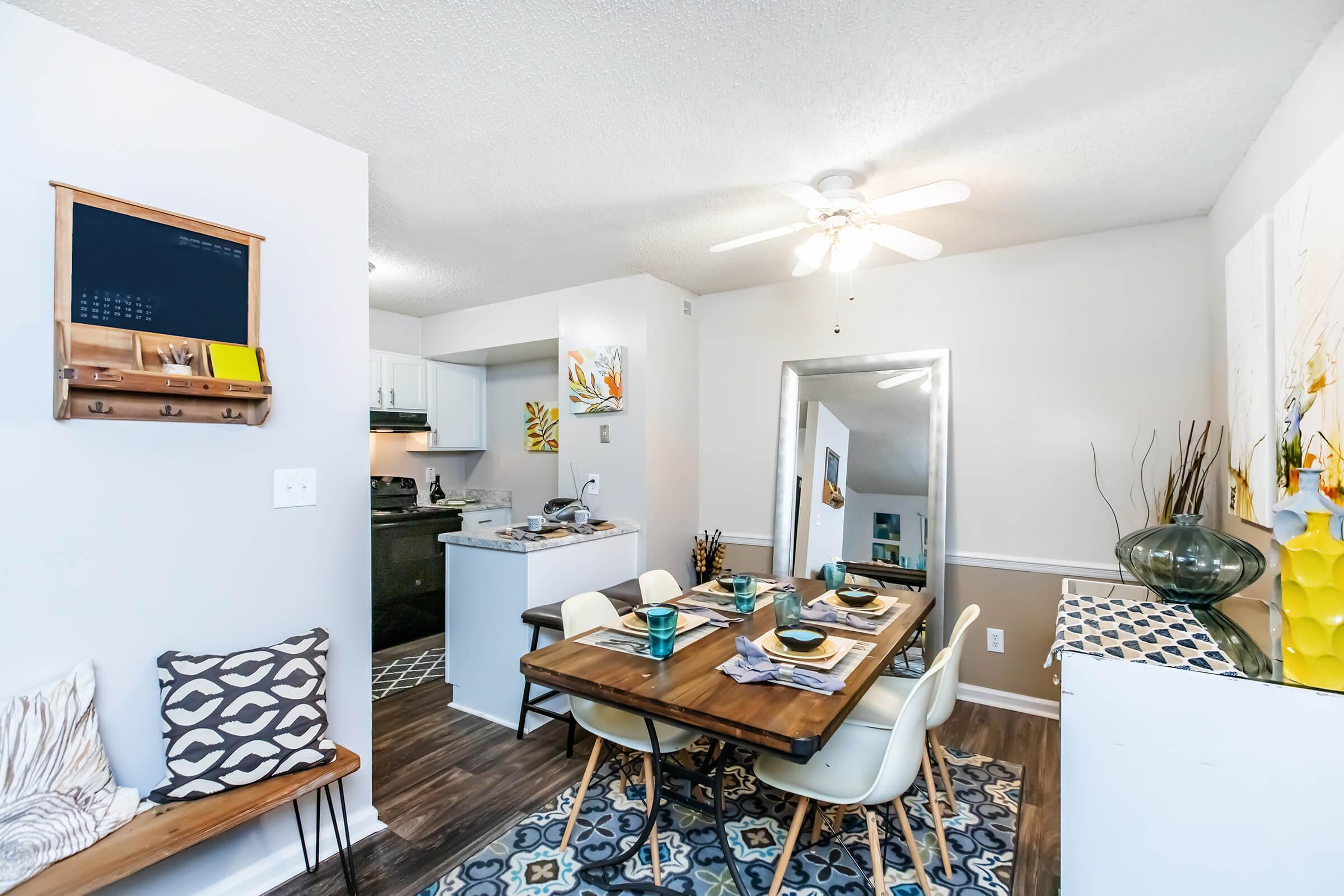 a living room filled with furniture and a table