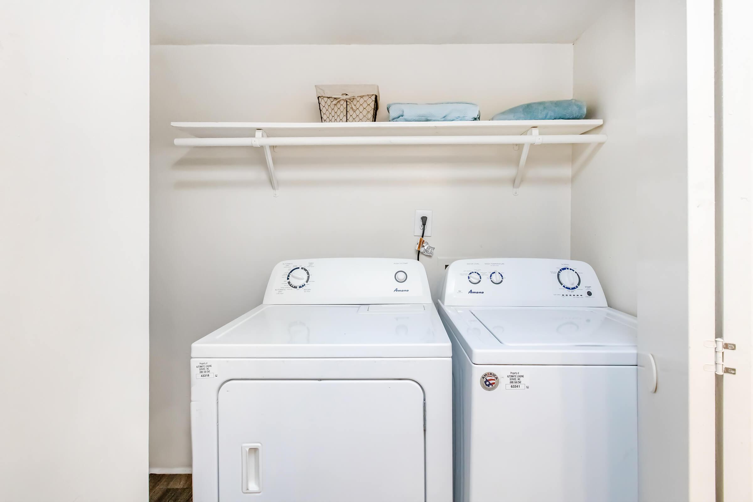 a refrigerator freezer sitting next to a sink