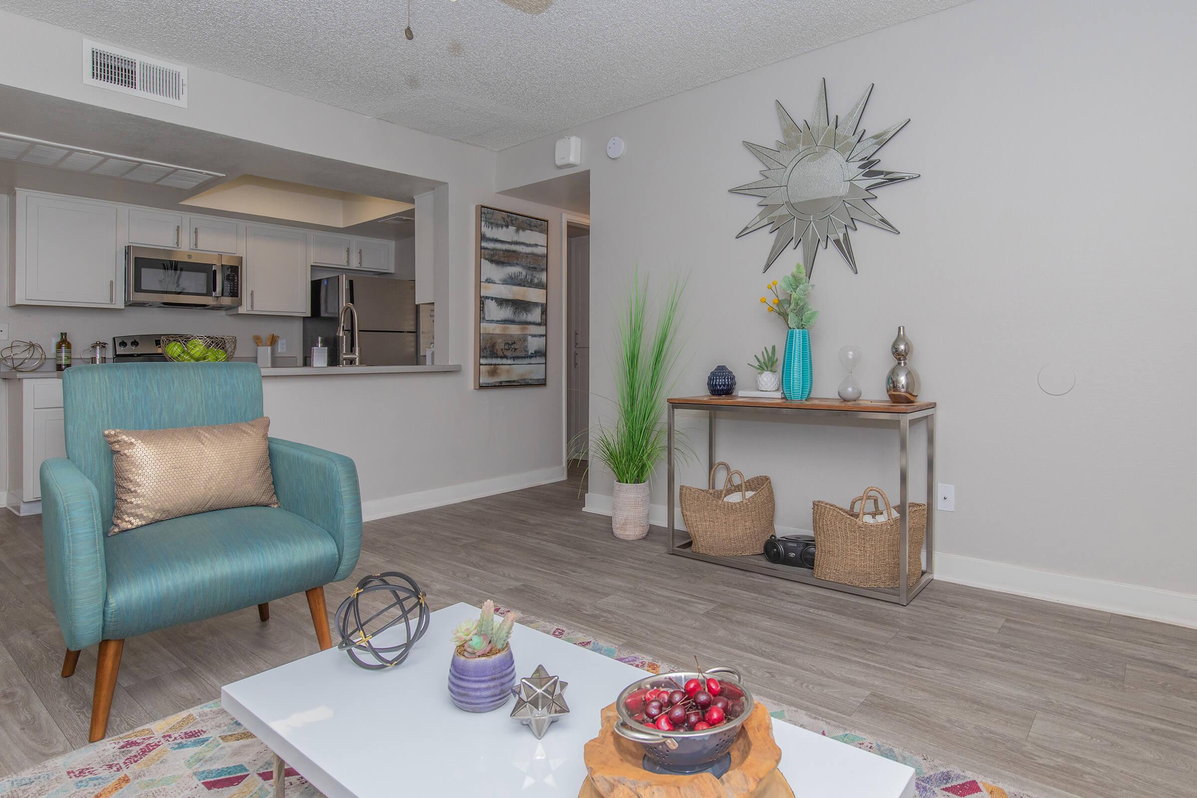 Furnished living room  with a view of the kitchen