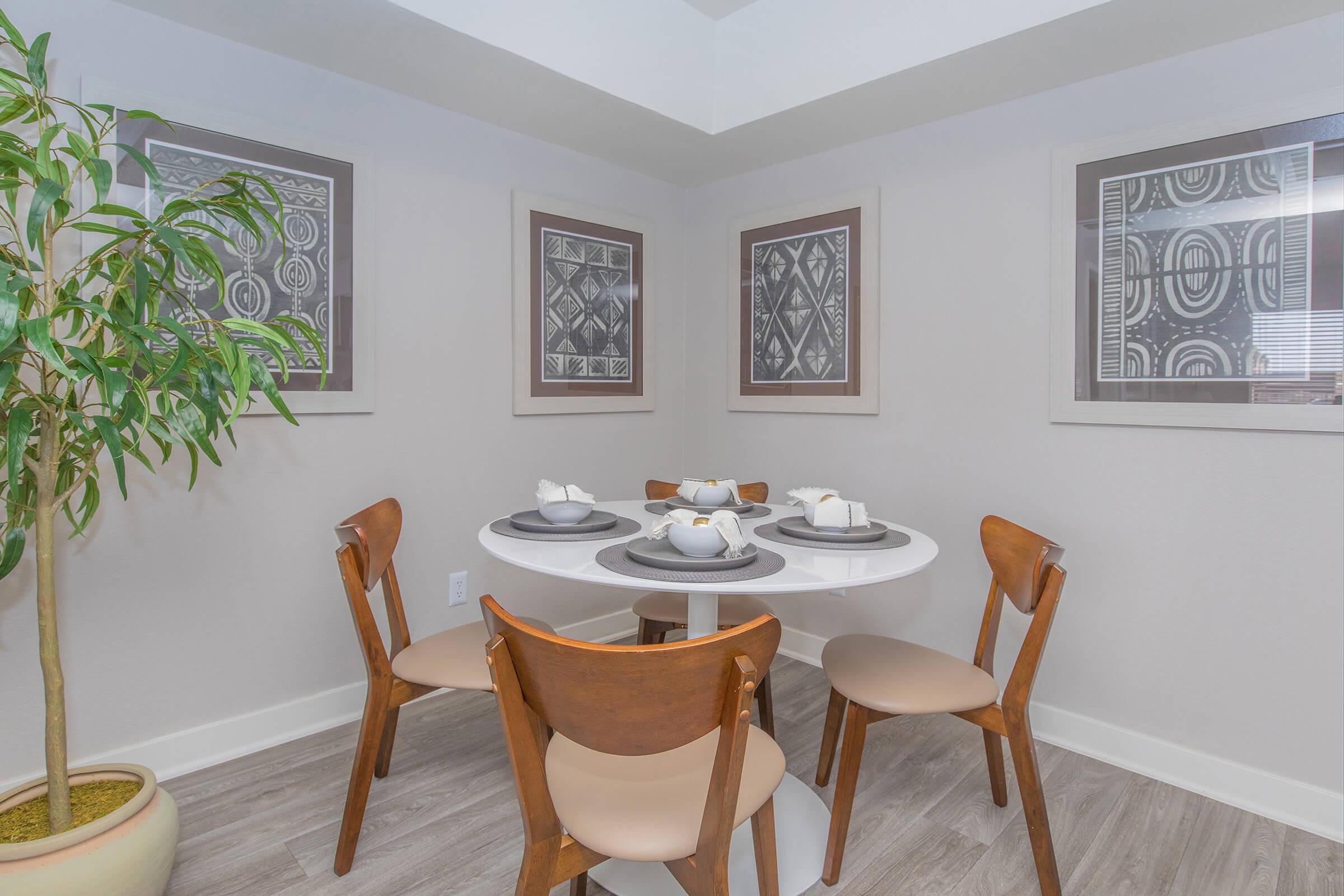 Mid-century modern circular dining table in a fresh modern dining room space