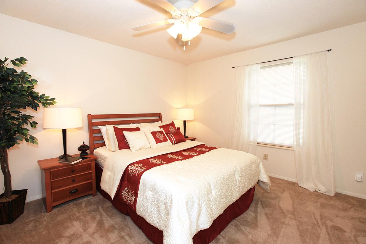 a bedroom with a bed in a hotel room