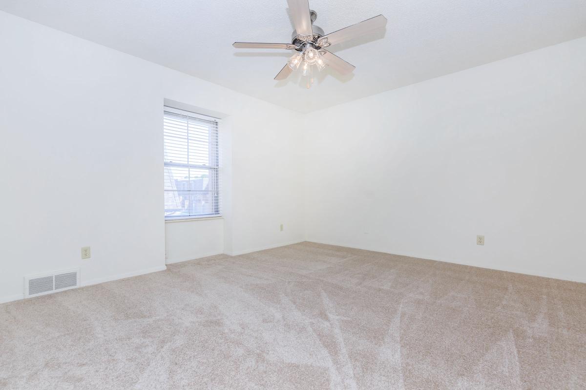 a bedroom with a bed in a room
