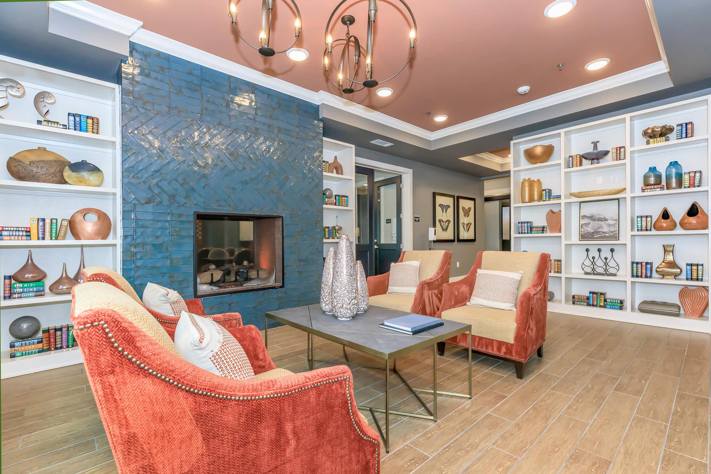a living room filled with furniture and a fireplace