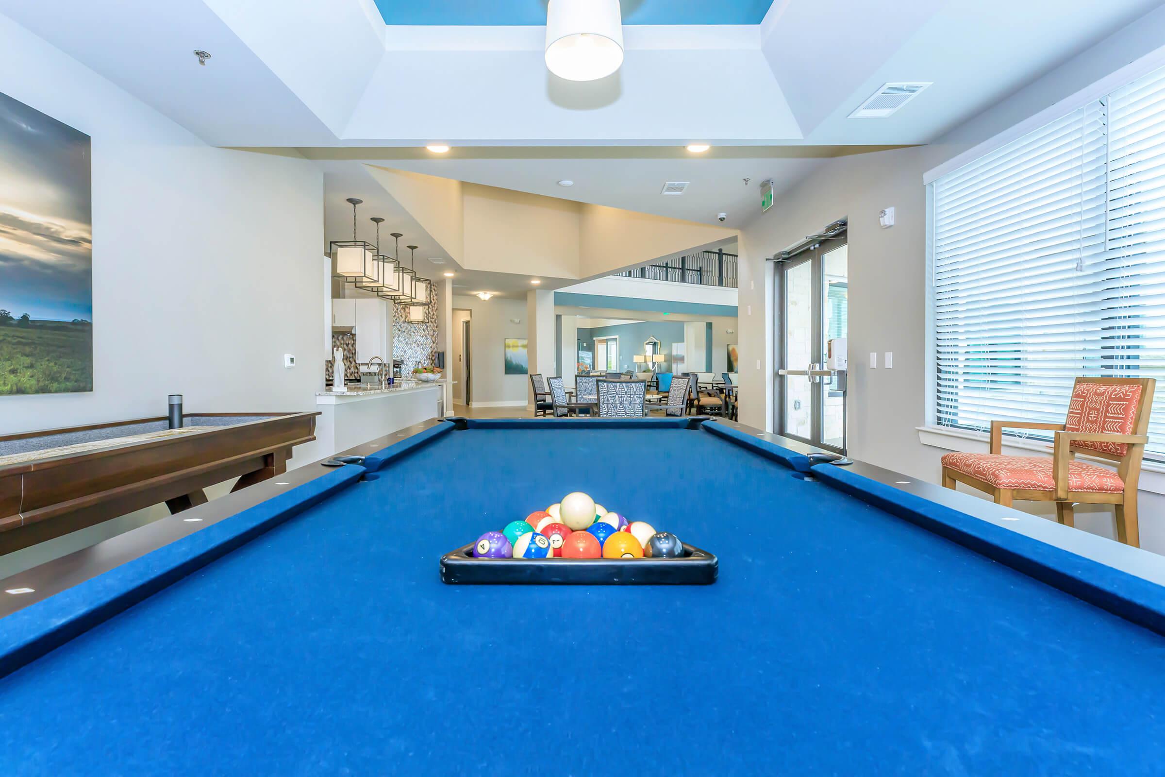 a glass with a blue ball inside a room