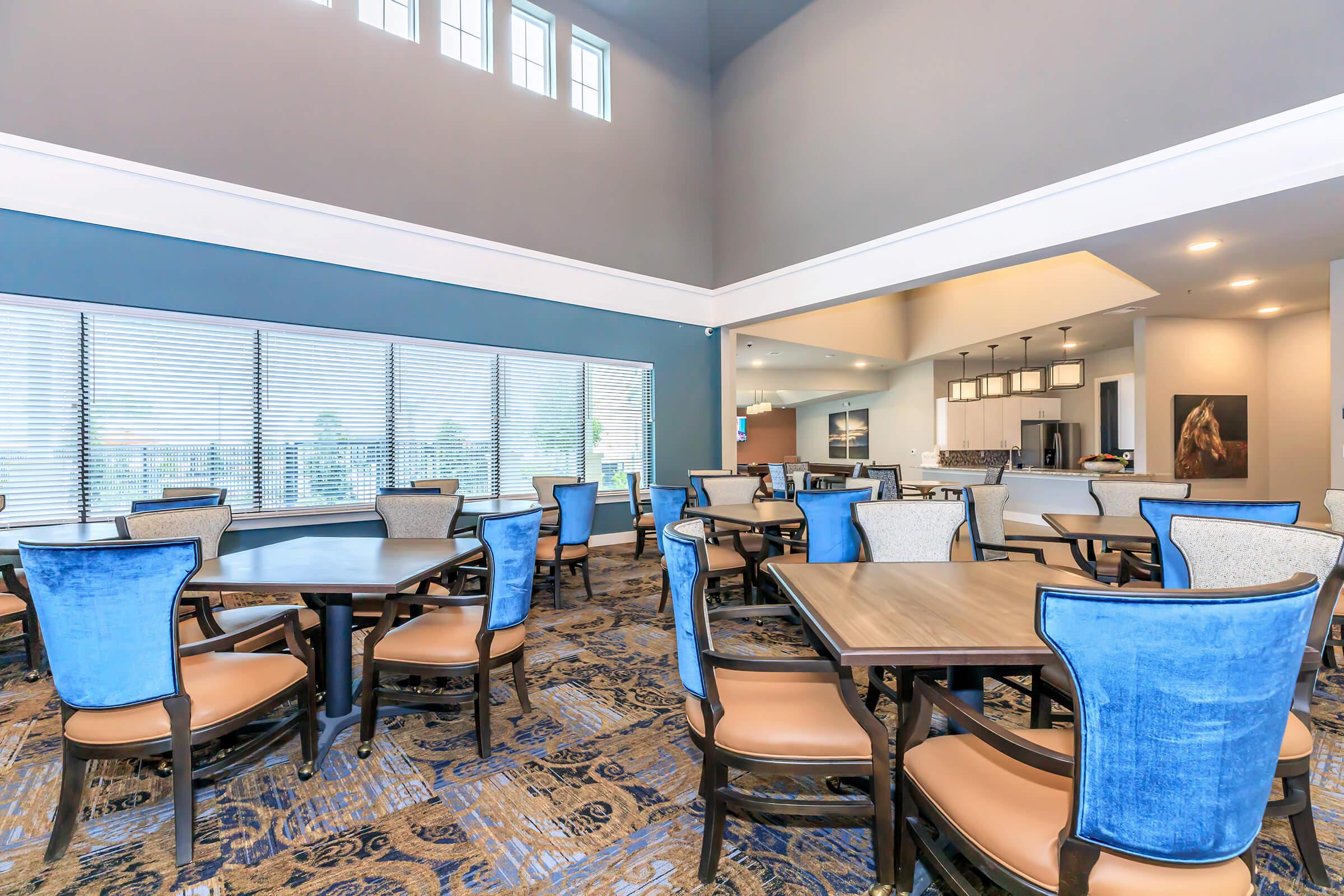 a room filled with furniture and a blue chair