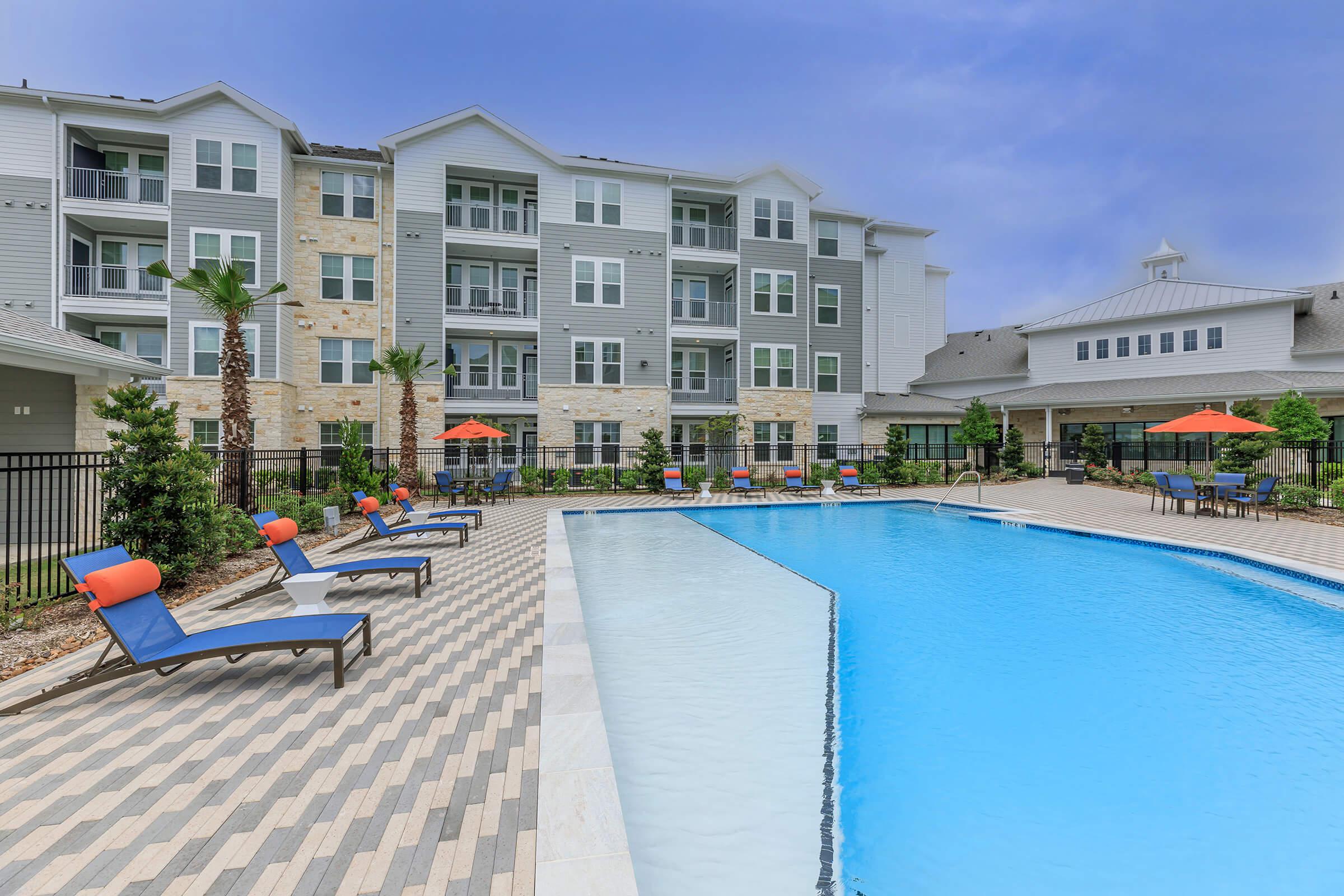 a large pool of water in front of a building