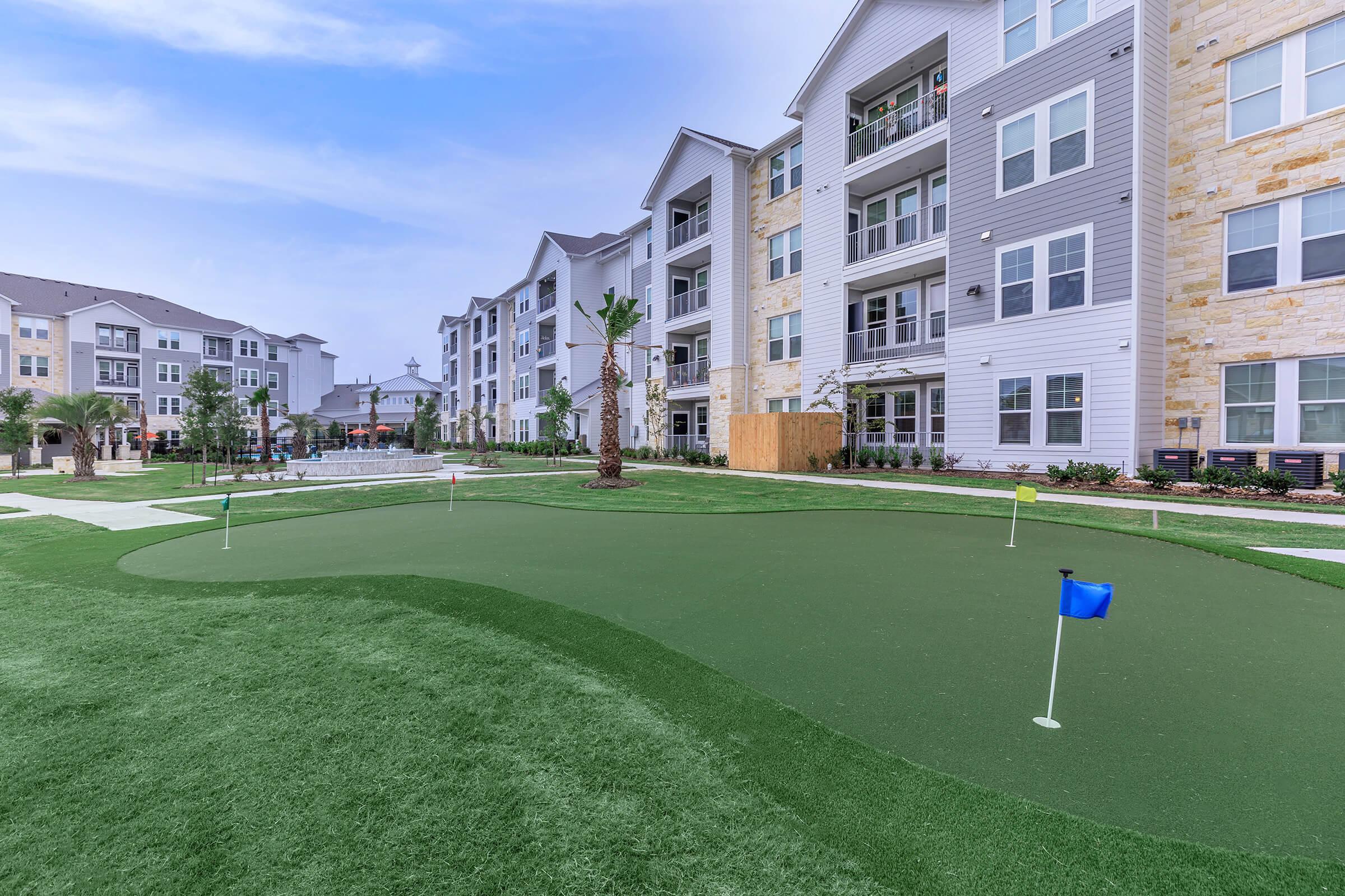 a large lawn in front of a building