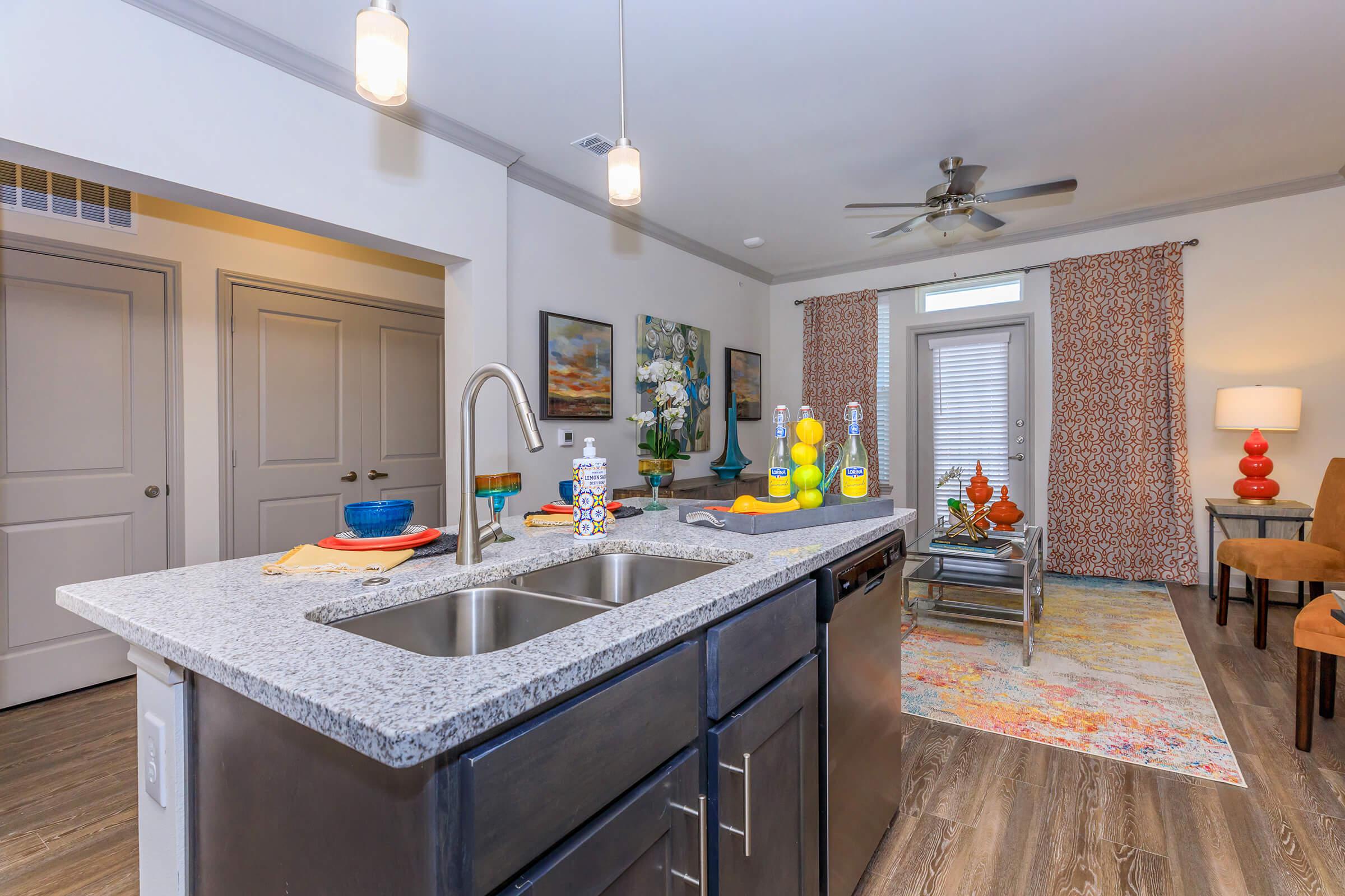 a kitchen with an island in the middle of a room