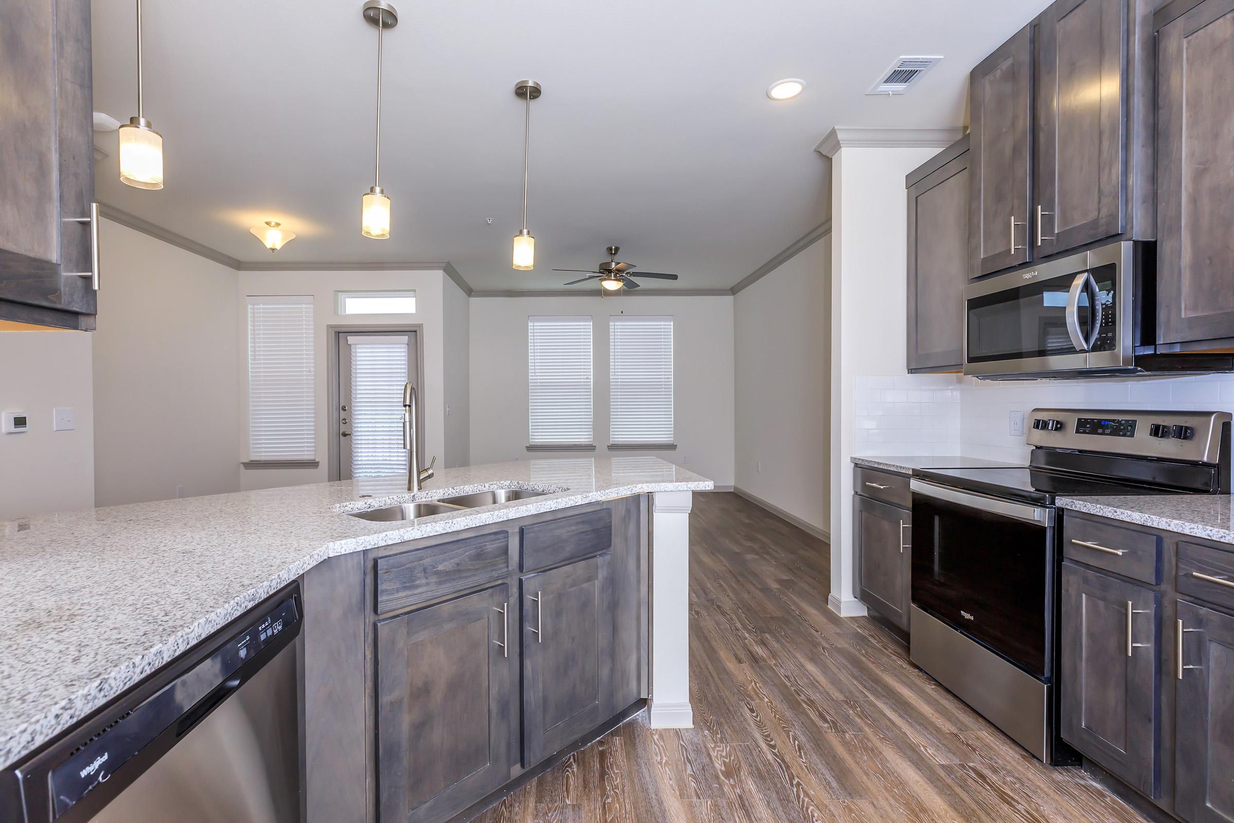 a modern kitchen with stainless steel appliances