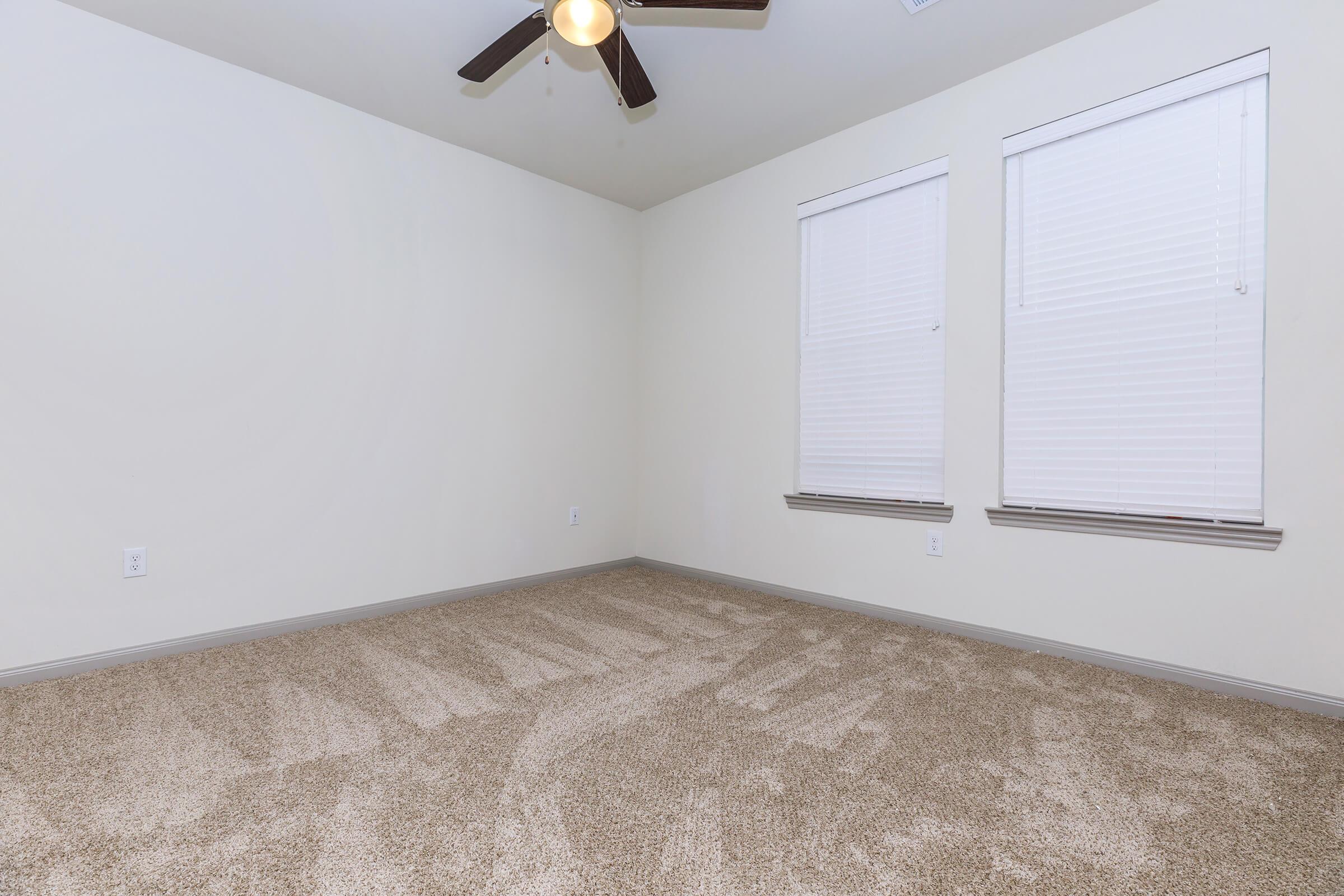a bedroom with a bed in a room