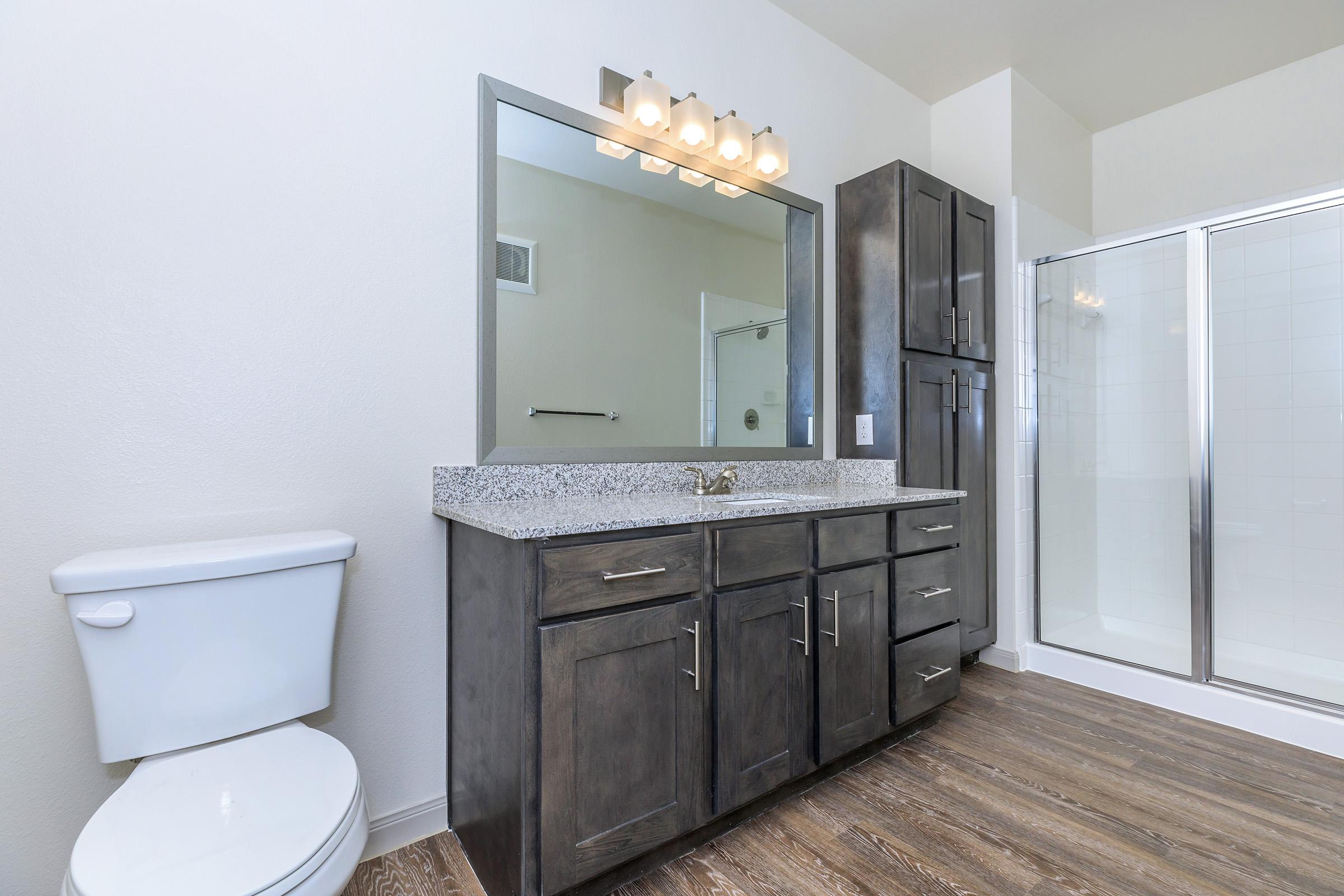 a room with a sink and a mirror