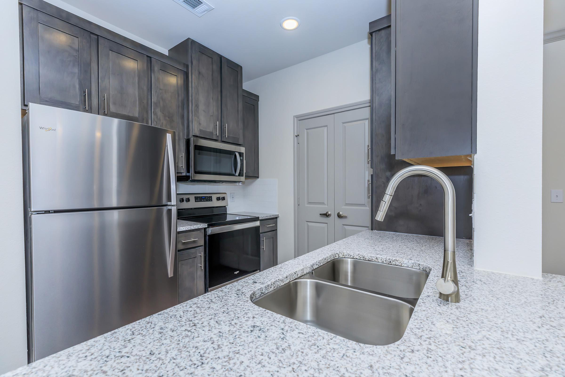 a stainless steel refrigerator in a kitchen