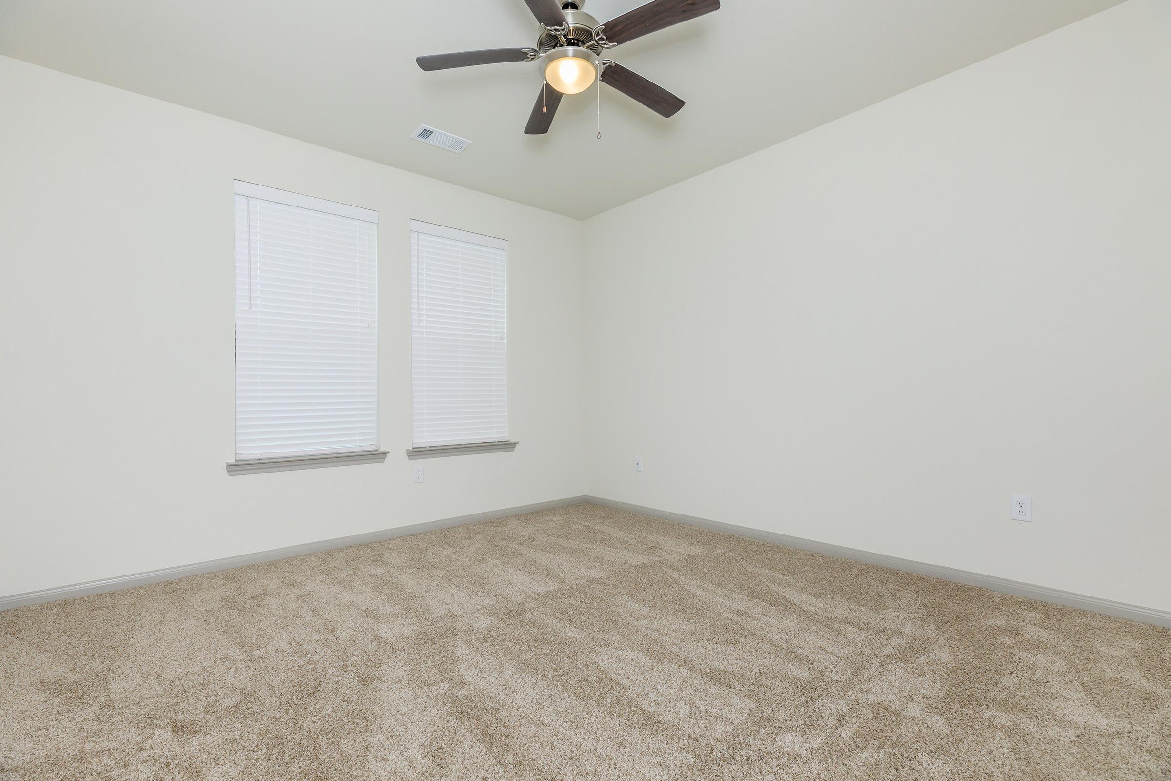 a bedroom with a bed and a mirror