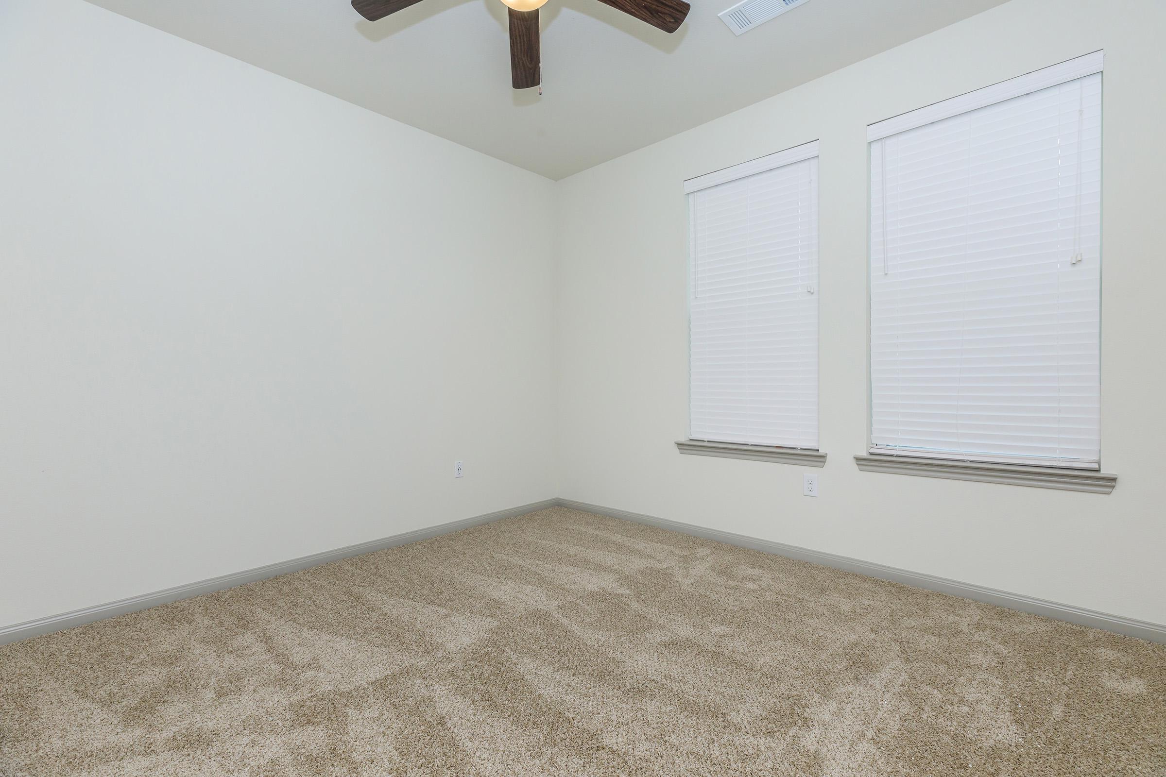 a bedroom with a bed and a mirror