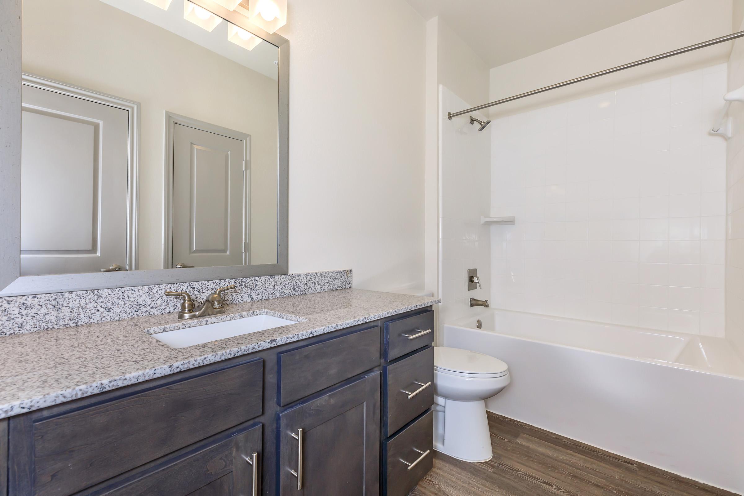 a room with a sink and a mirror