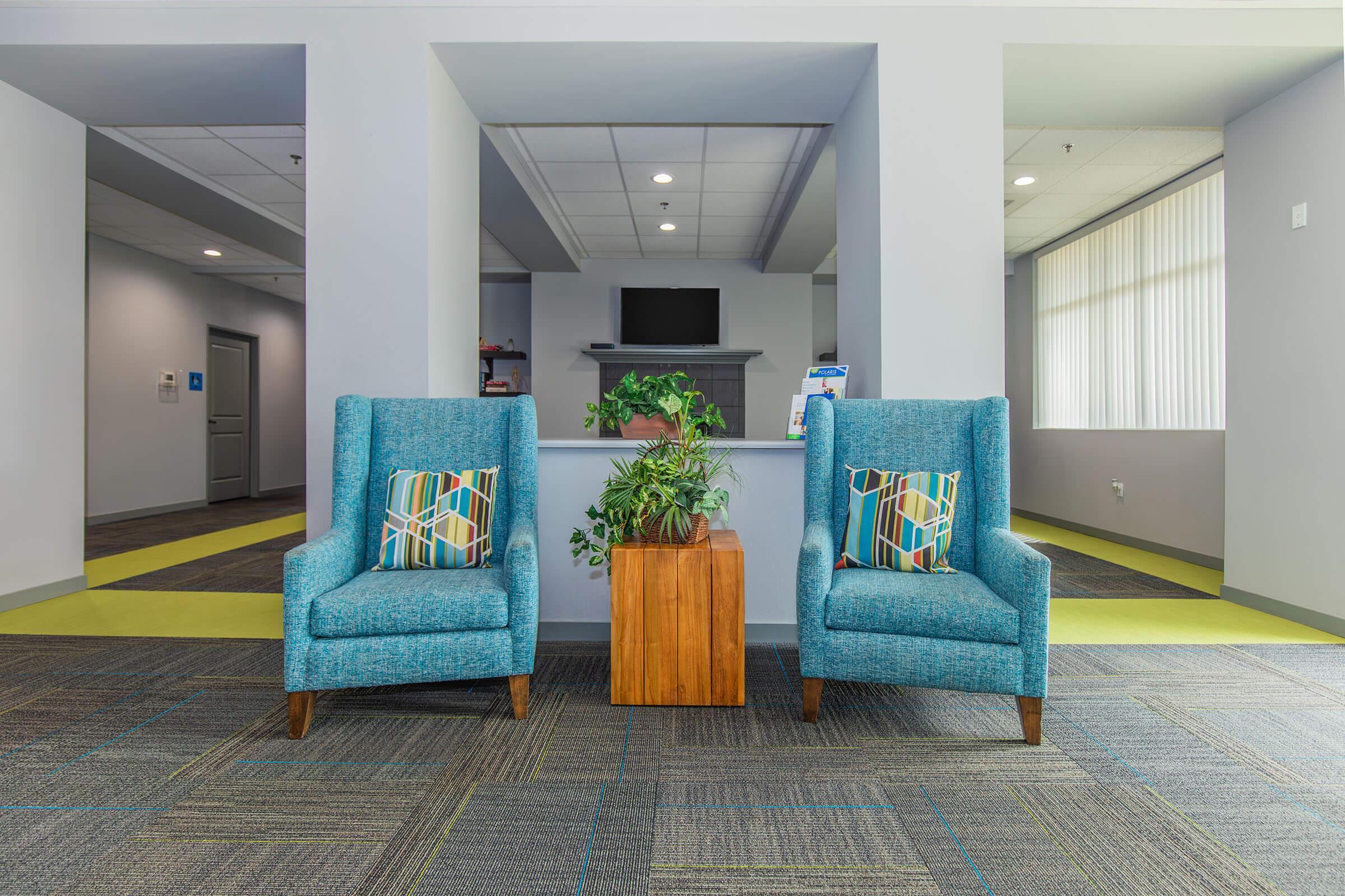 a living room with blue walls