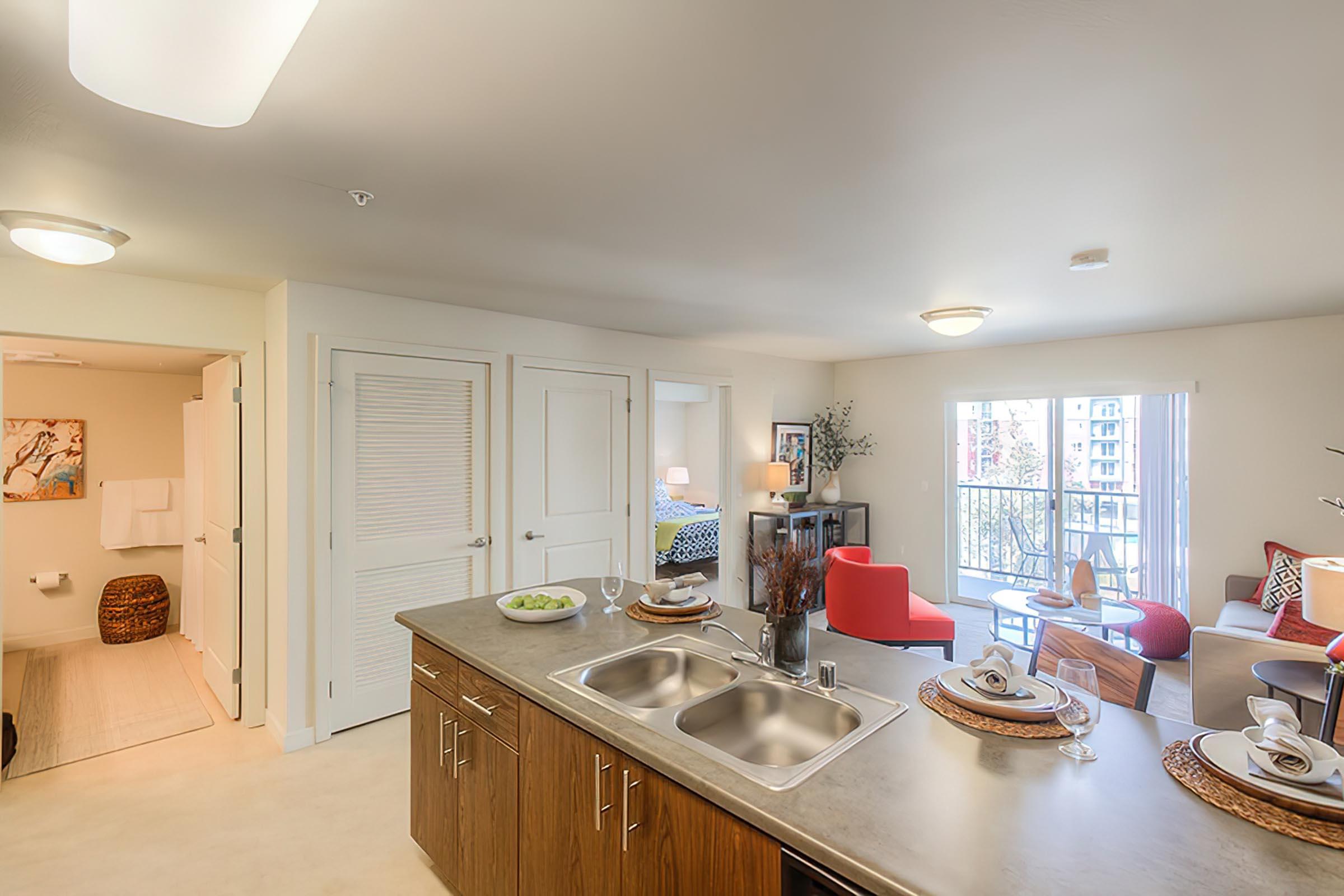 a kitchen with an island in the middle of a room