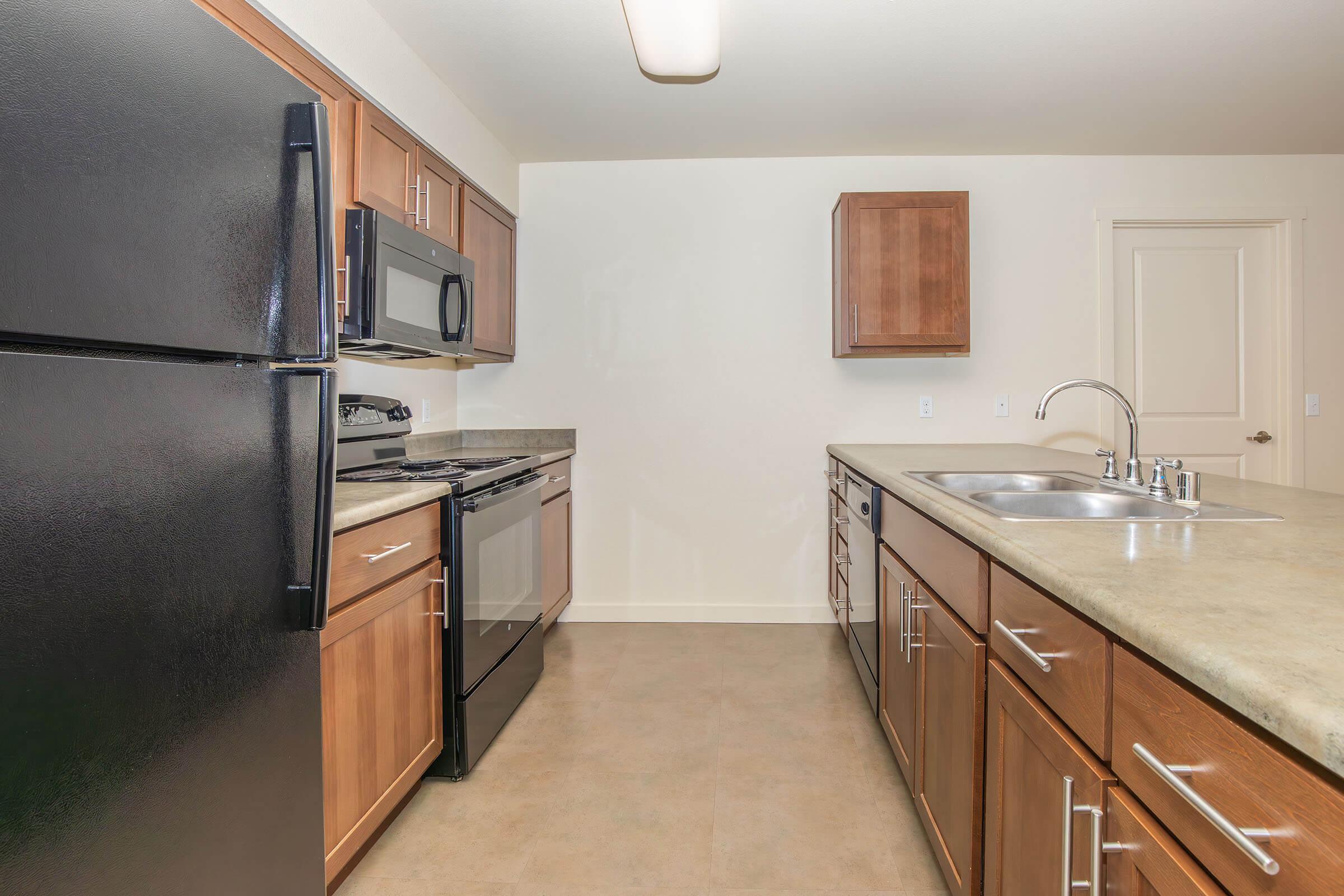 a stainless steel refrigerator in a kitchen