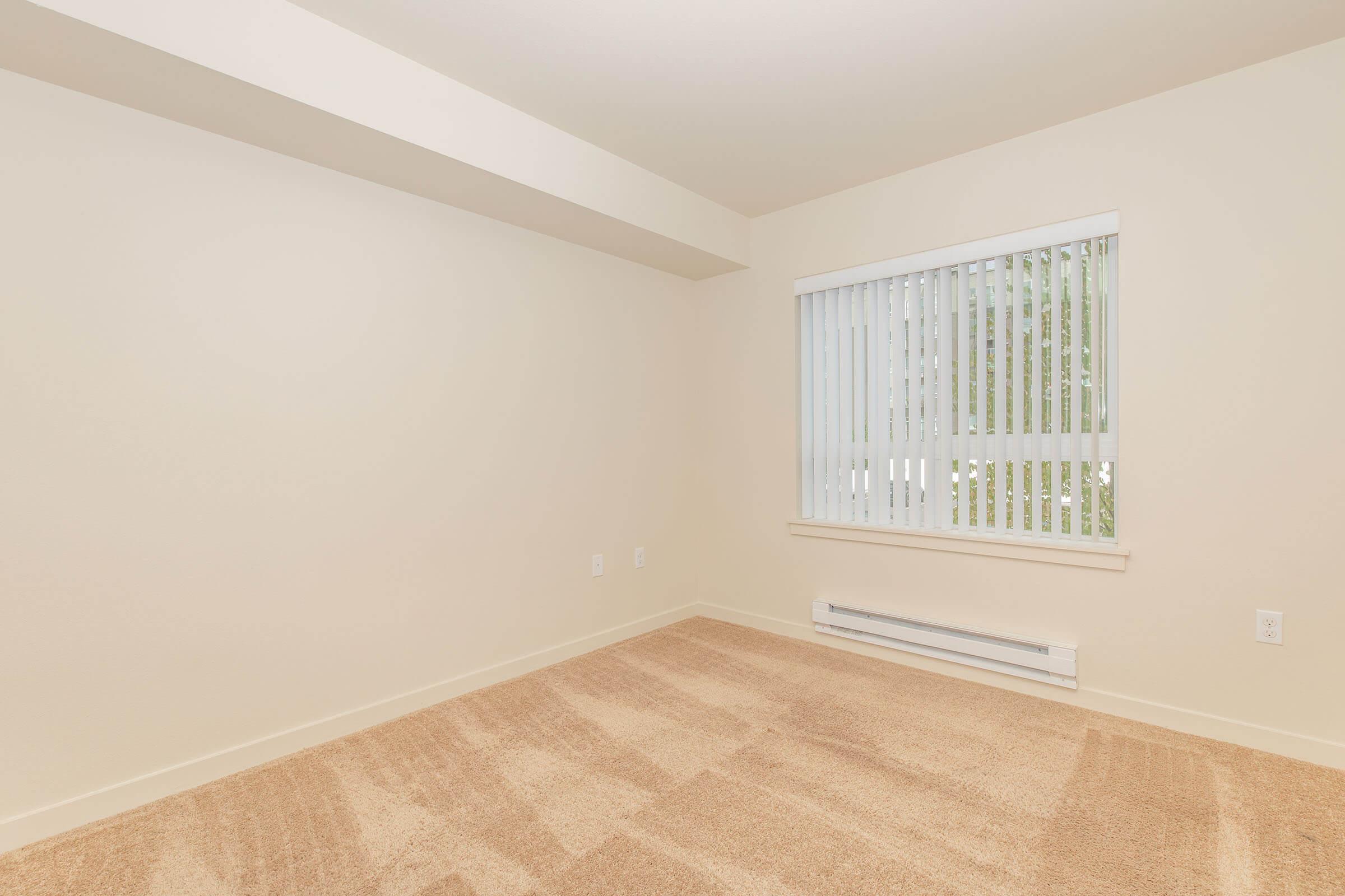 a bedroom with a large window