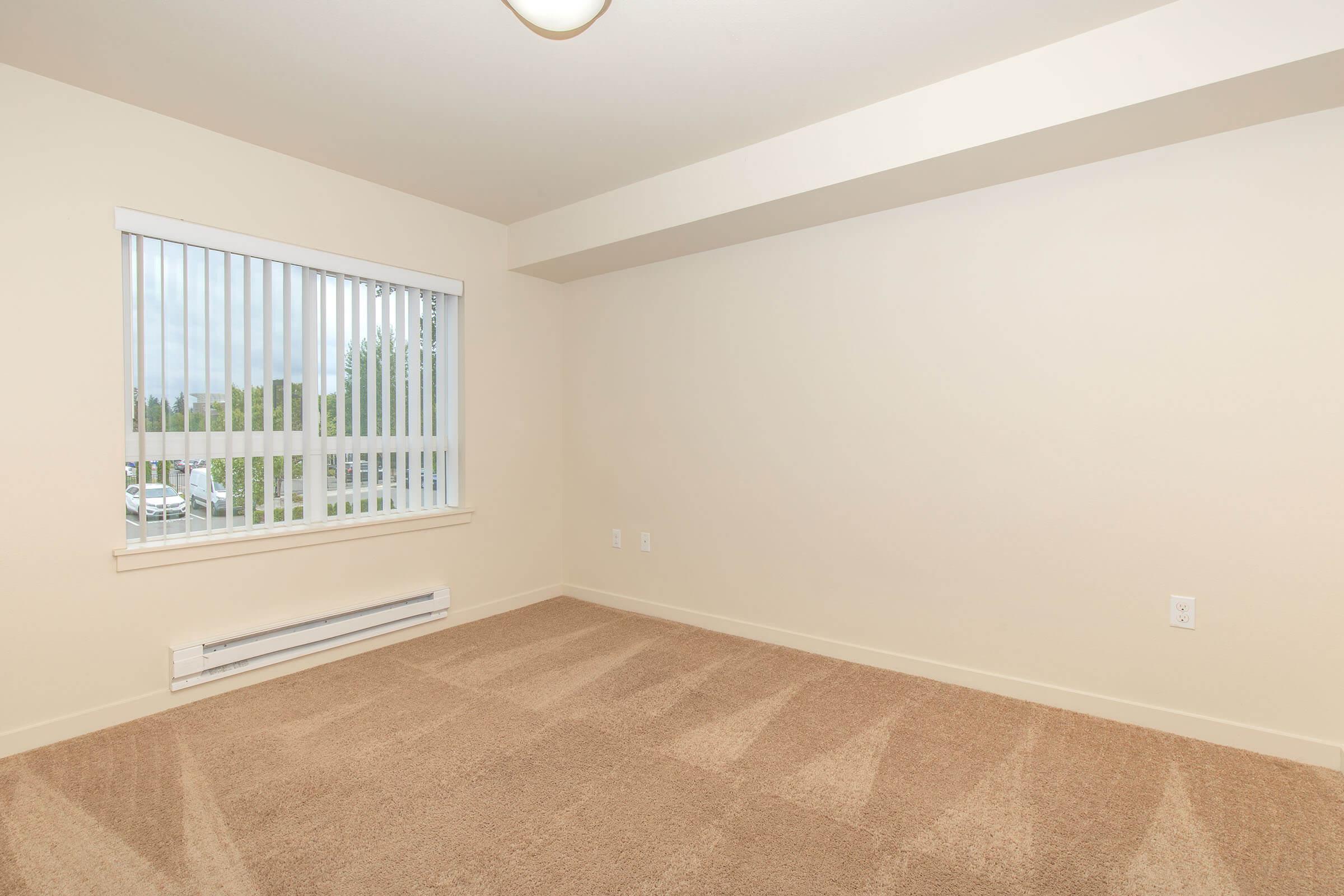 a bedroom with a large window