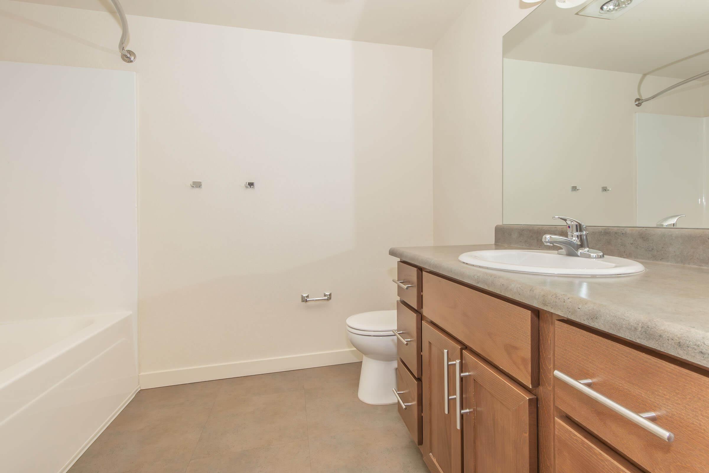 a kitchen with a sink and a mirror