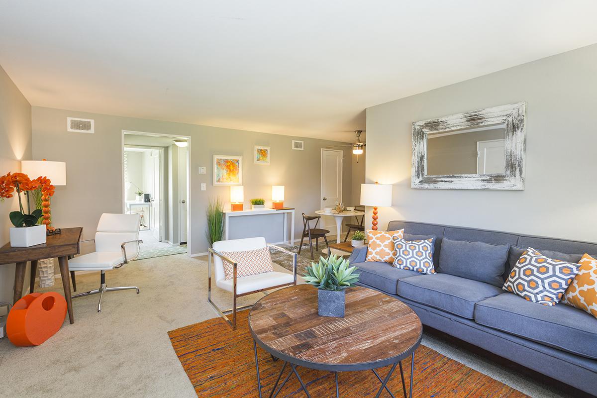 a living room filled with furniture and a fireplace