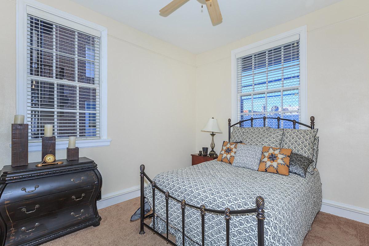 a bedroom with a large window