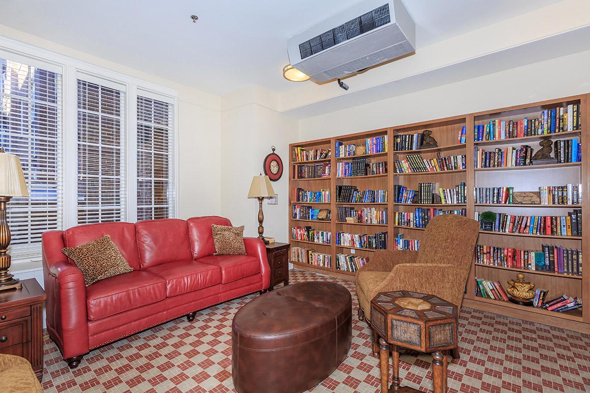 a living room filled with furniture and a flat screen tv