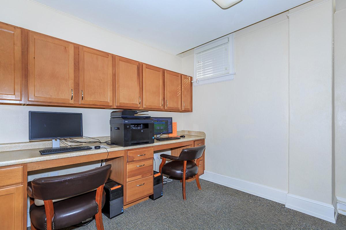 a kitchen with wooden cabinets