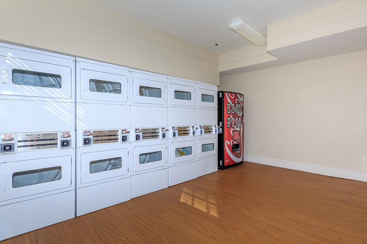 a kitchen with white cabinets