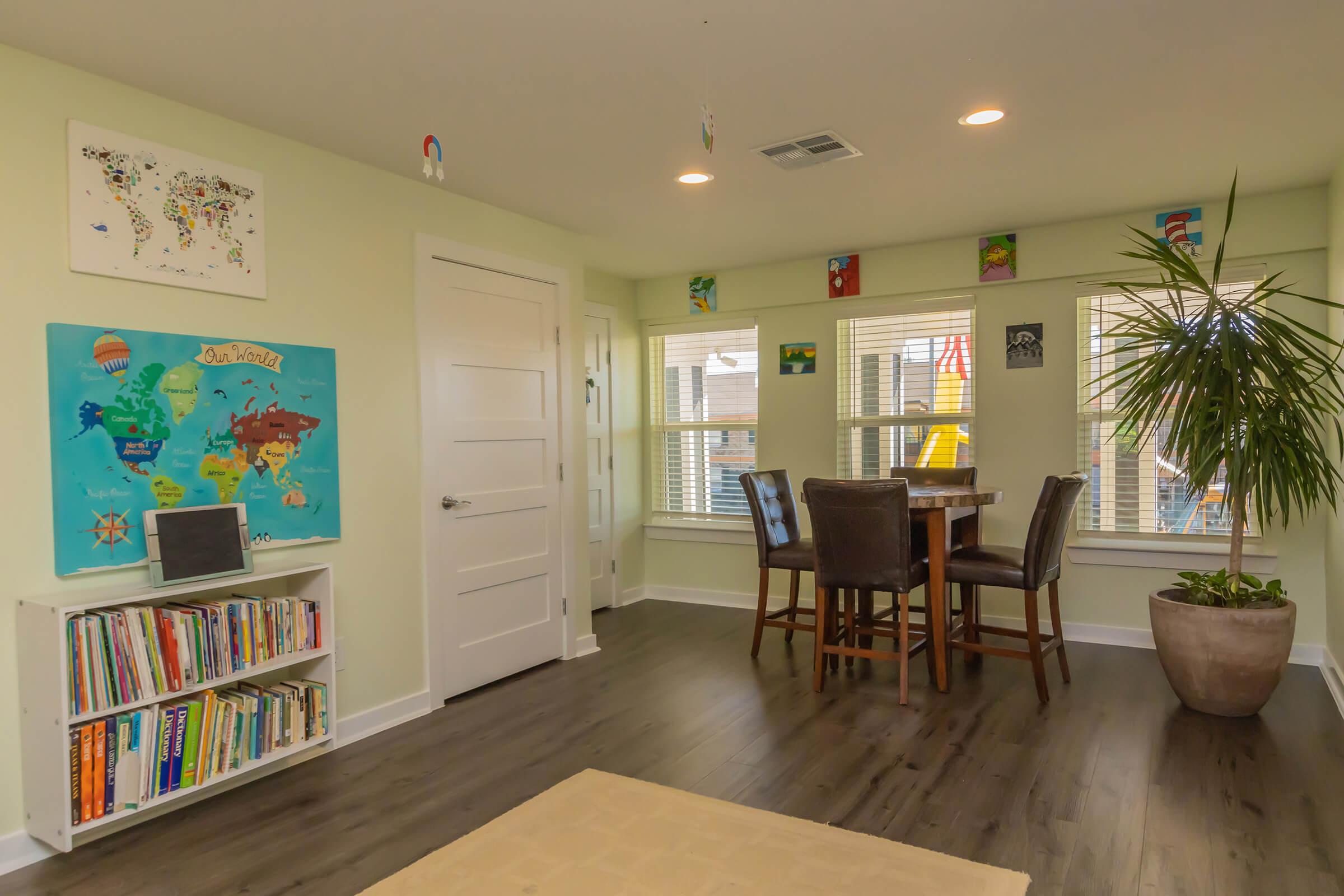 a living room filled with furniture and a tv