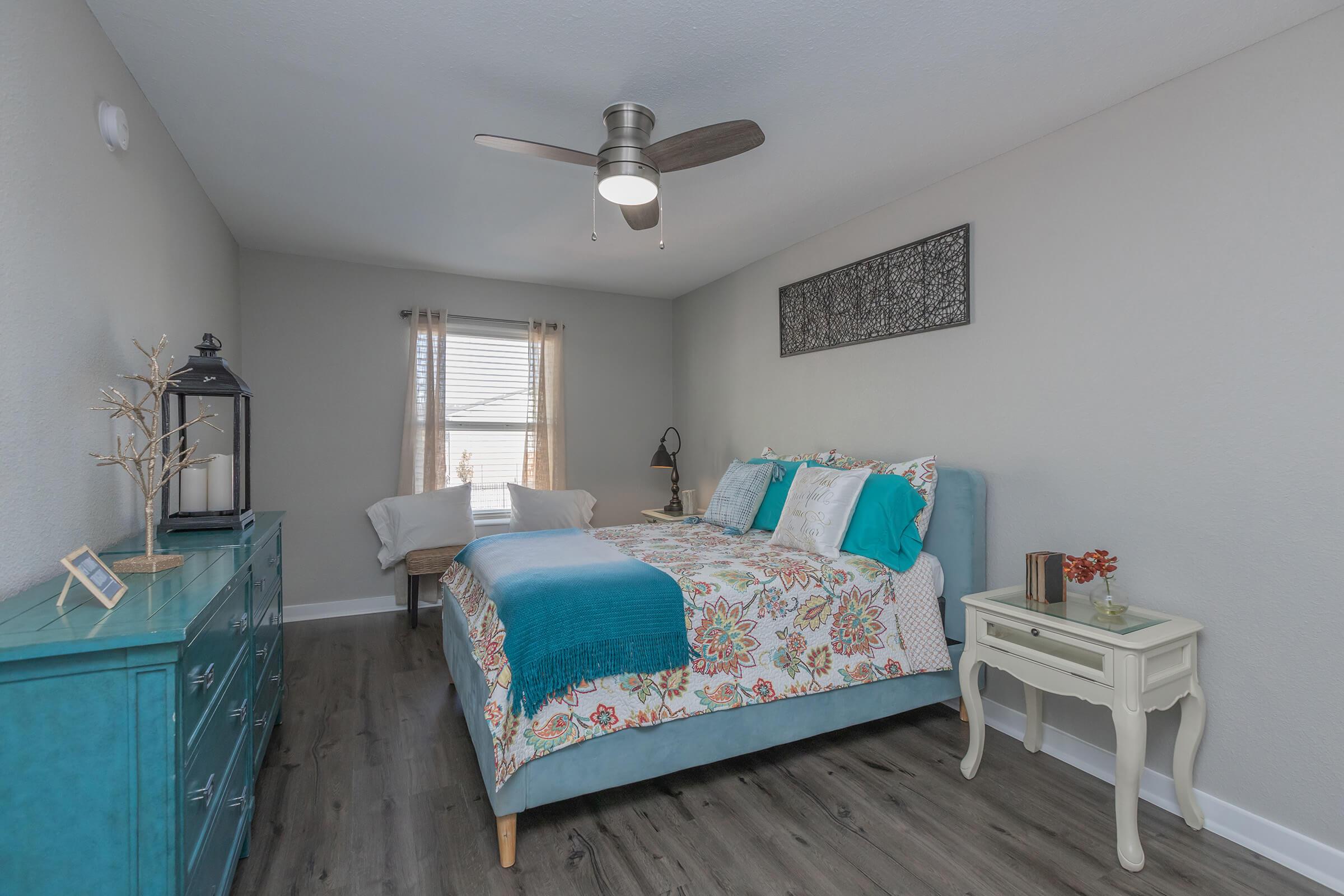 a living room filled with furniture and a bed