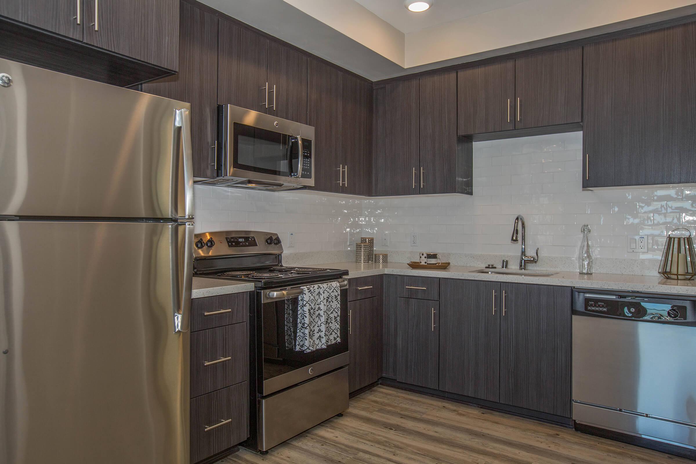 a stainless steel refrigerator in a kitchen