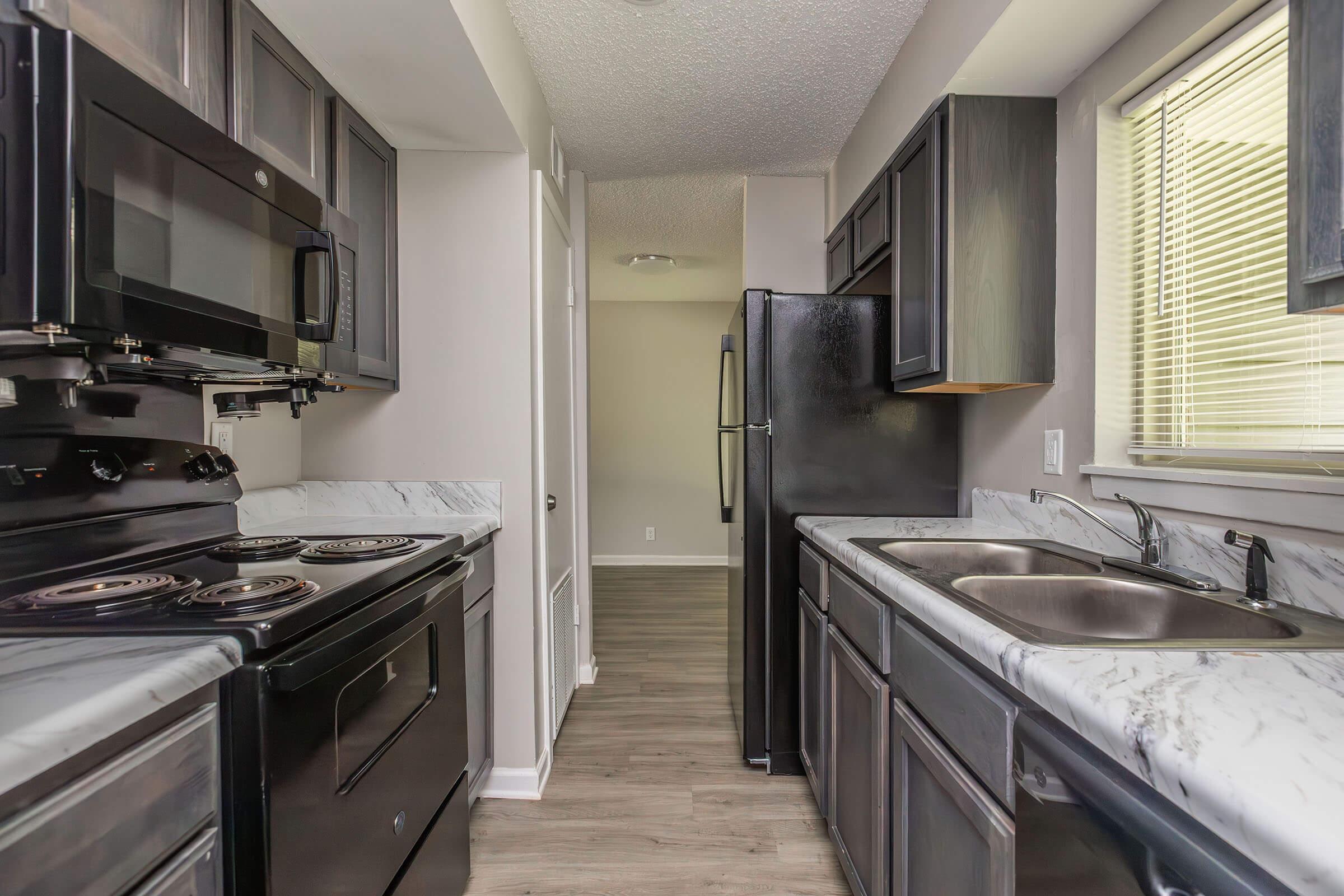 a large kitchen with stainless steel appliances