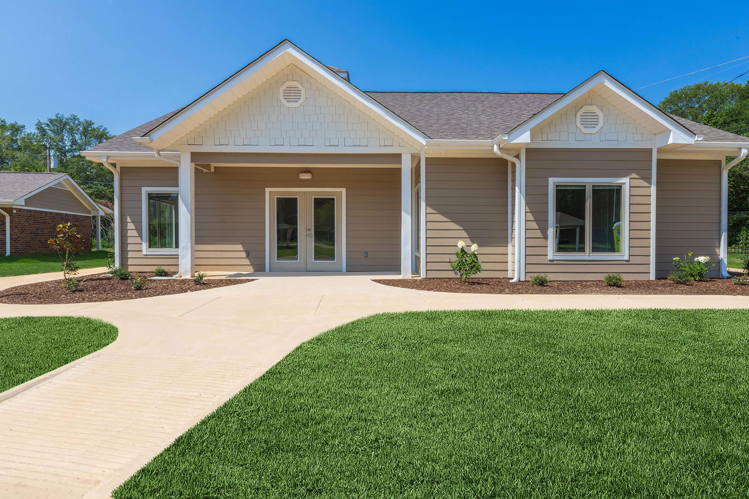 a large lawn in front of a house