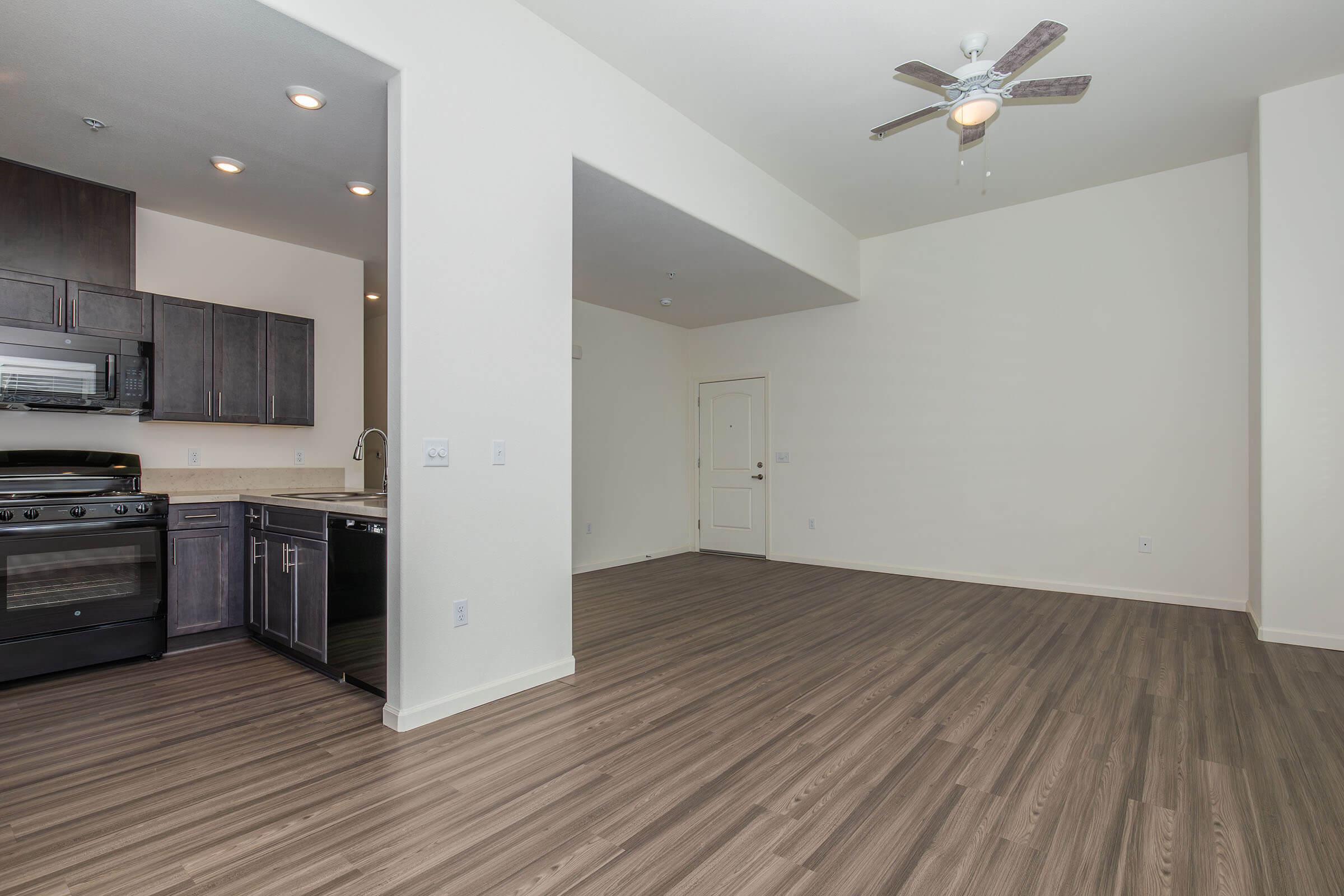 a kitchen with a wood floor