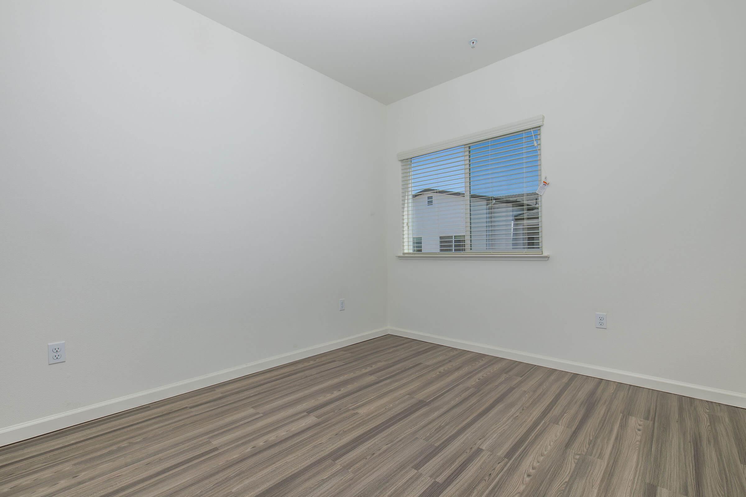 a bedroom with a large window