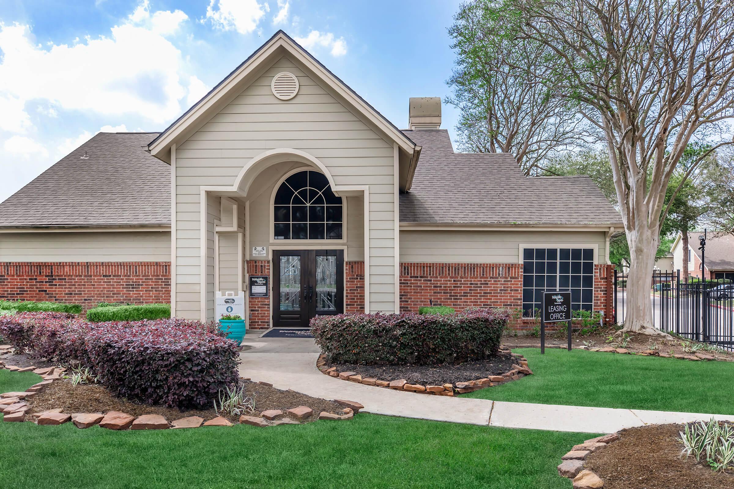 a large lawn in front of a house