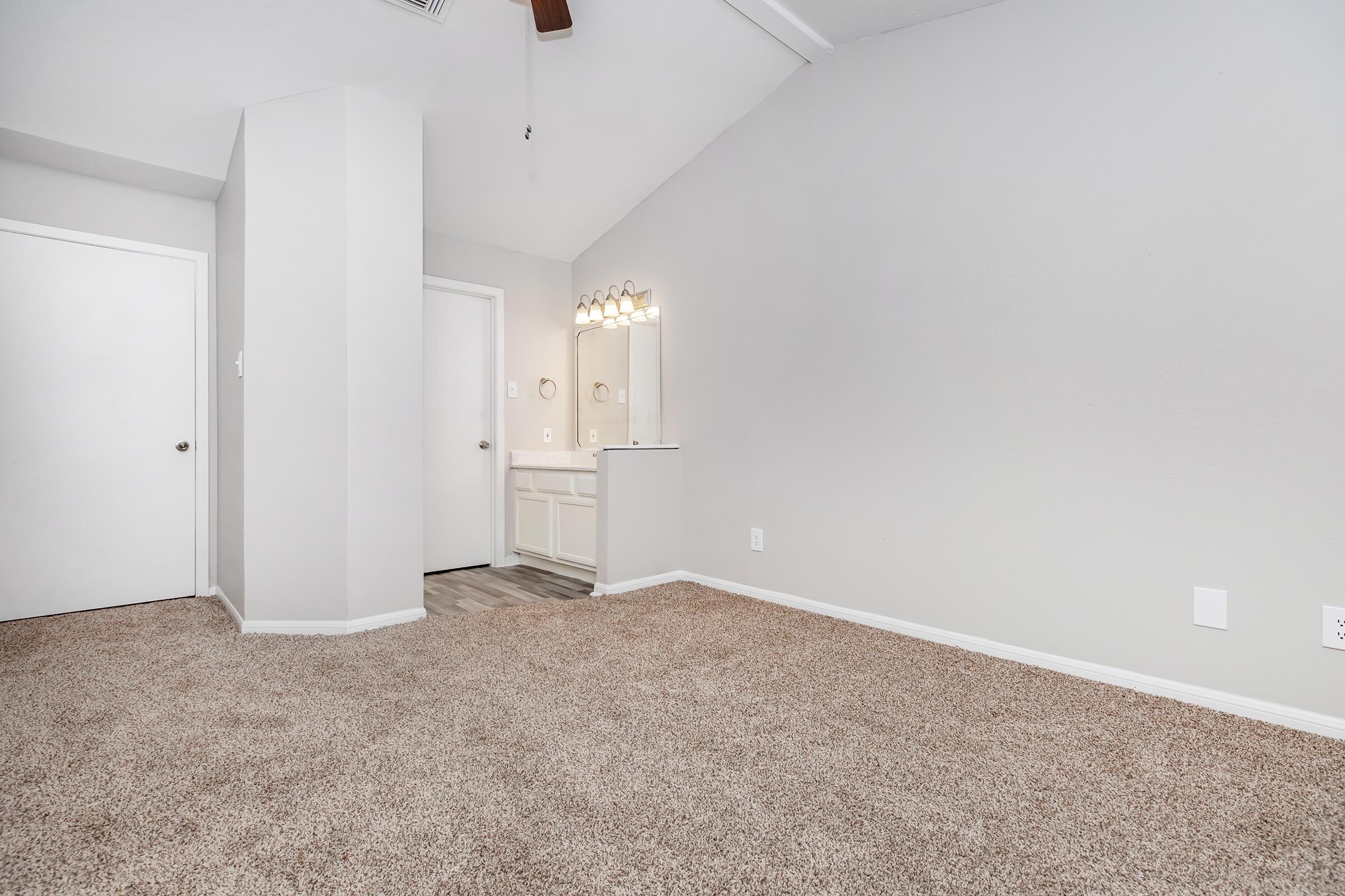 a bedroom with a large mirror