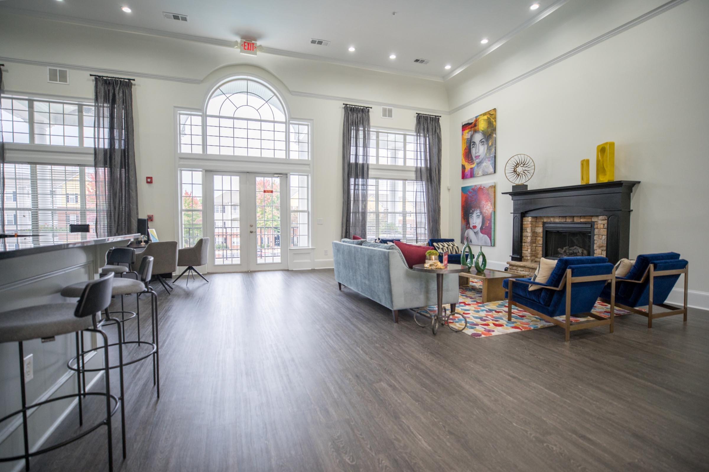 a living room filled with furniture and a large window