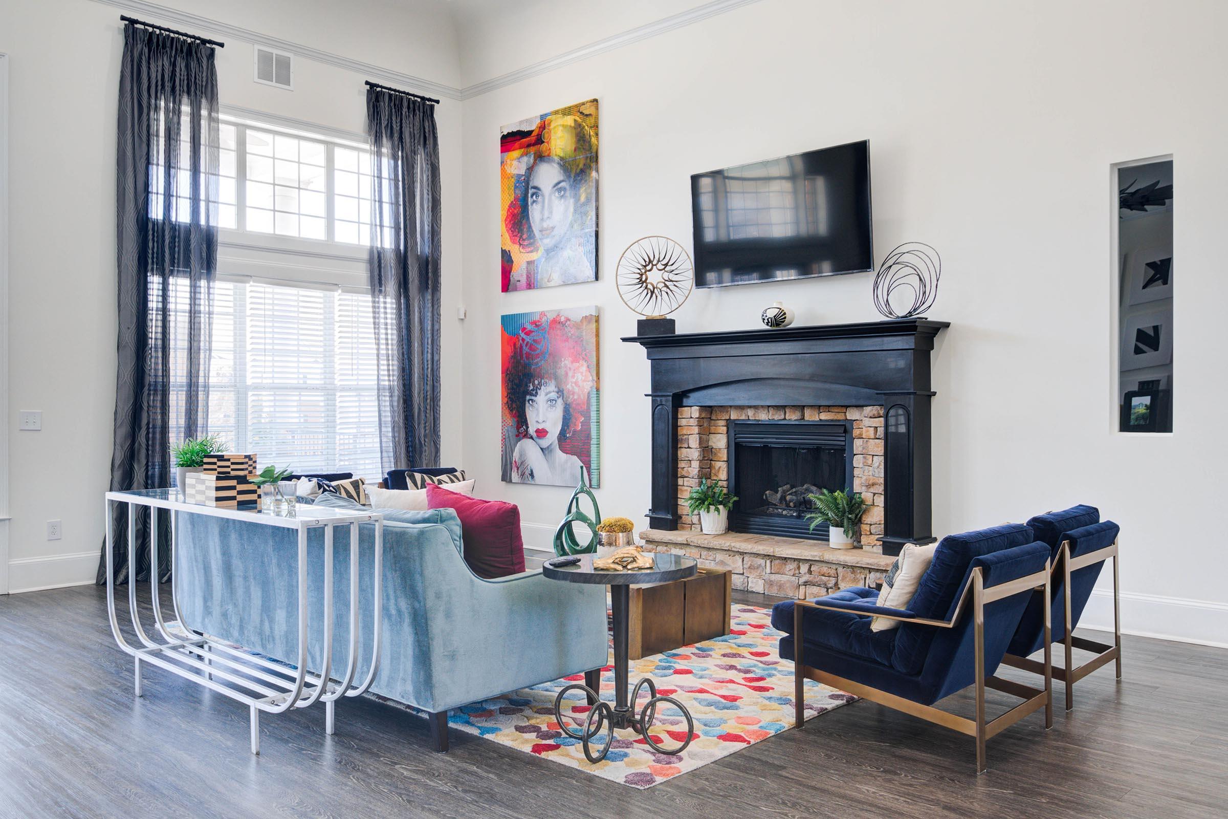 a living room filled with furniture and a fireplace