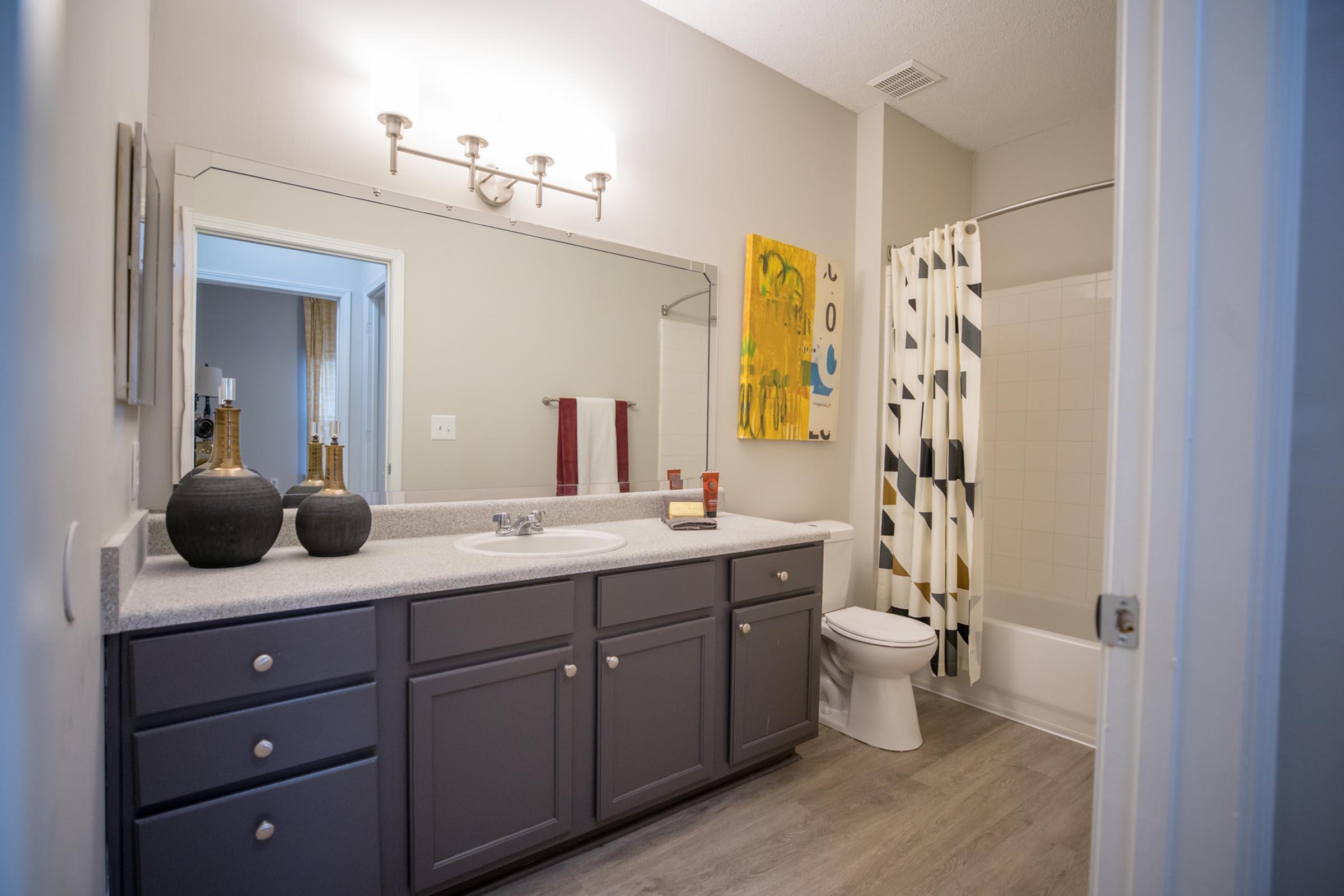 a kitchen with a sink and a mirror