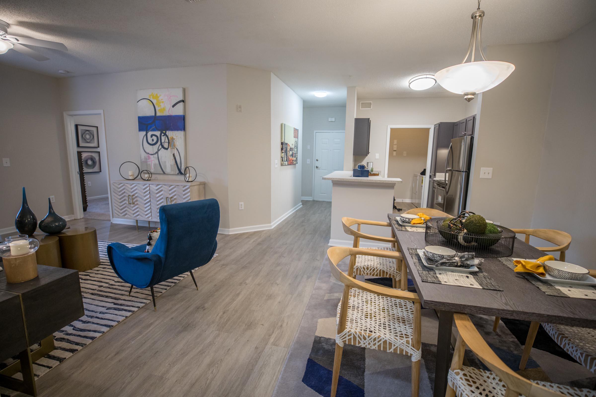 a living room filled with furniture and a table