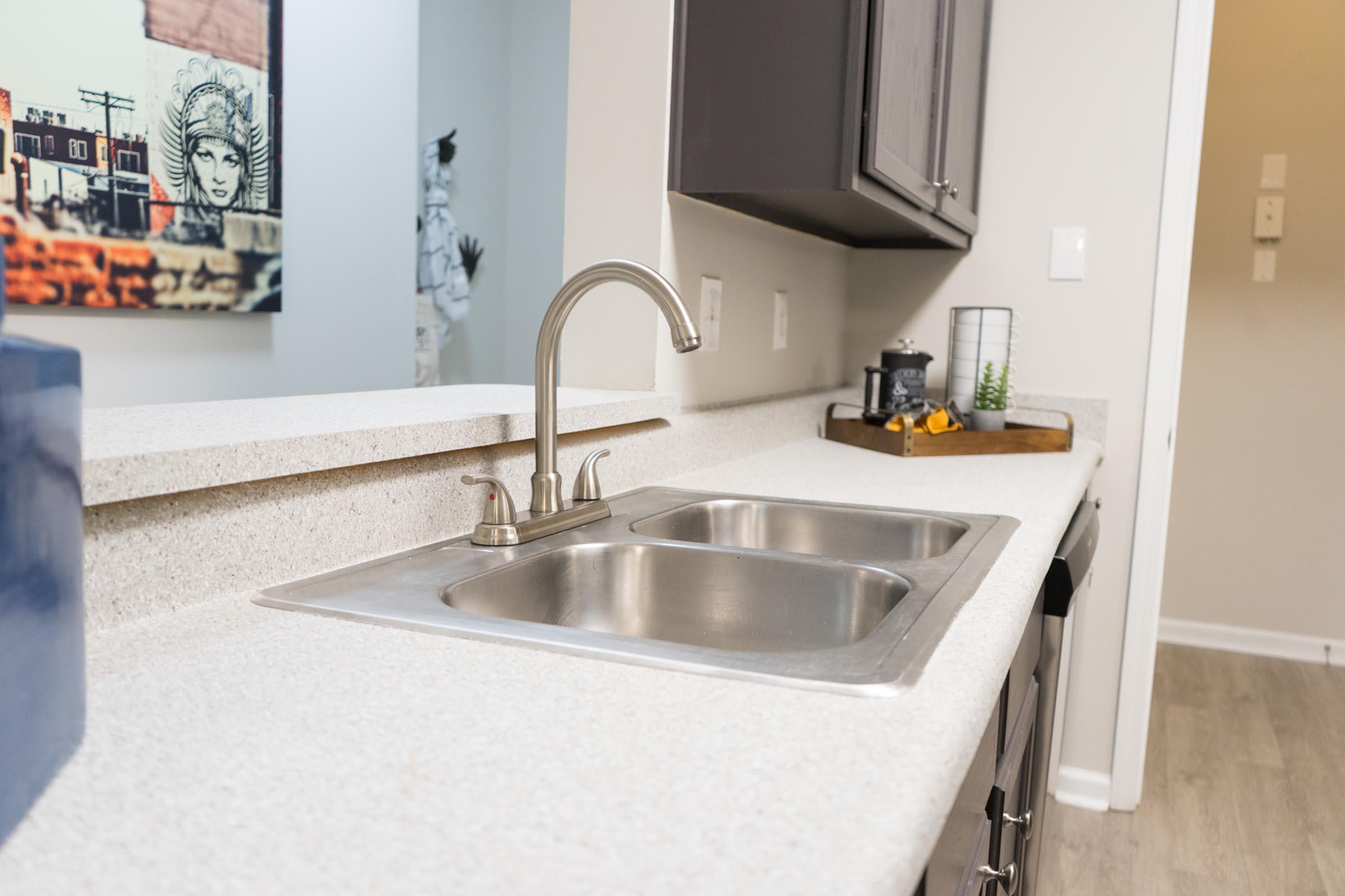 a kitchen with a stove and a sink