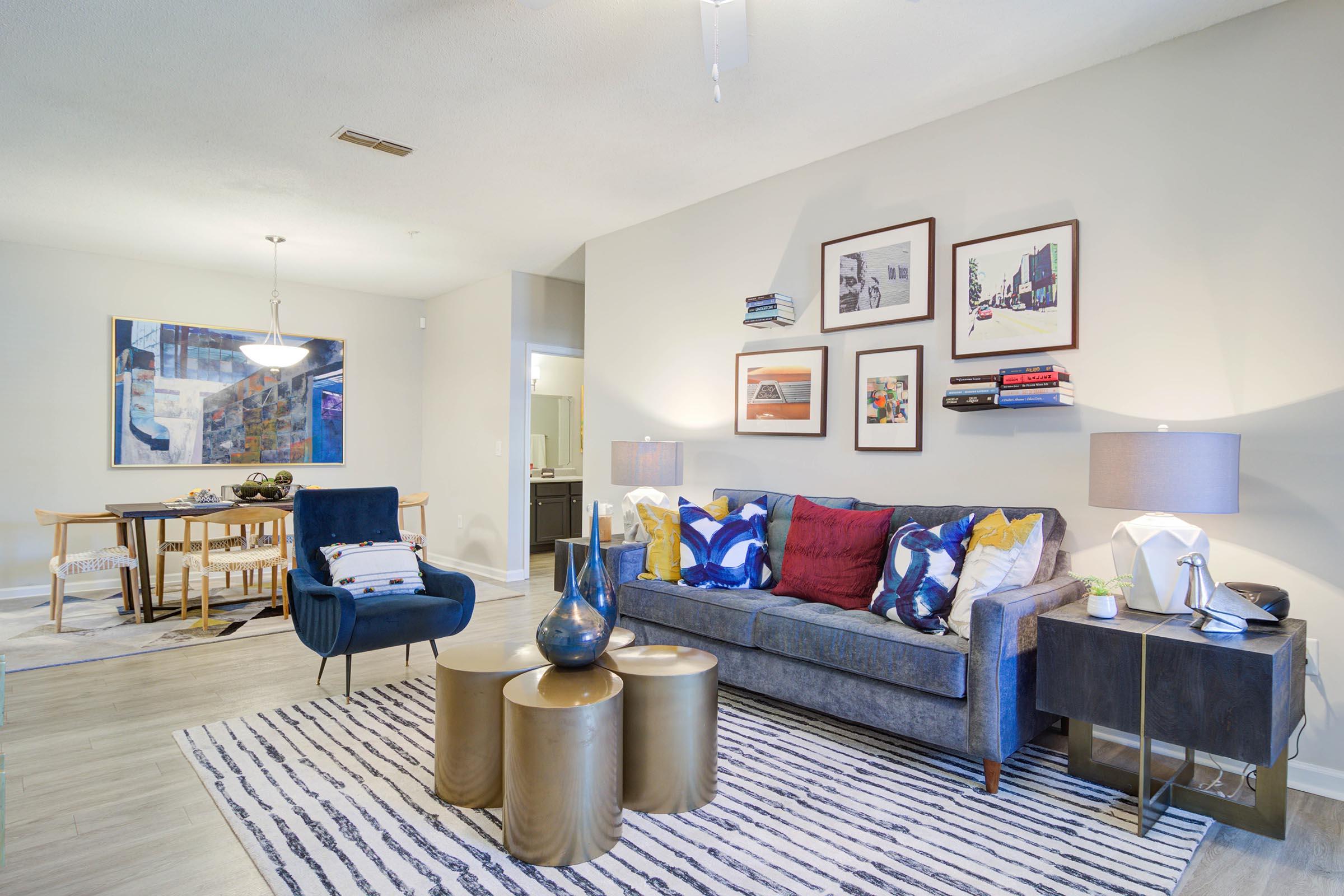 a living room filled with furniture and a table