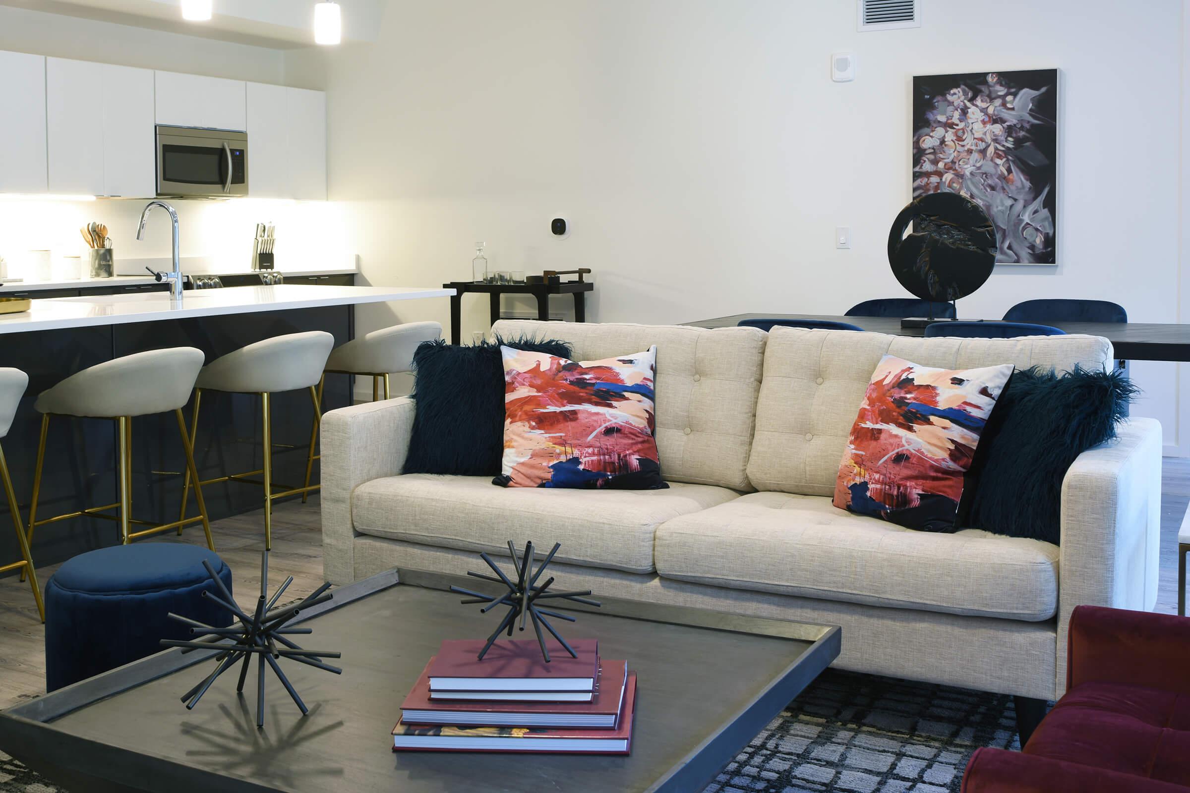 a living room filled with furniture and a table