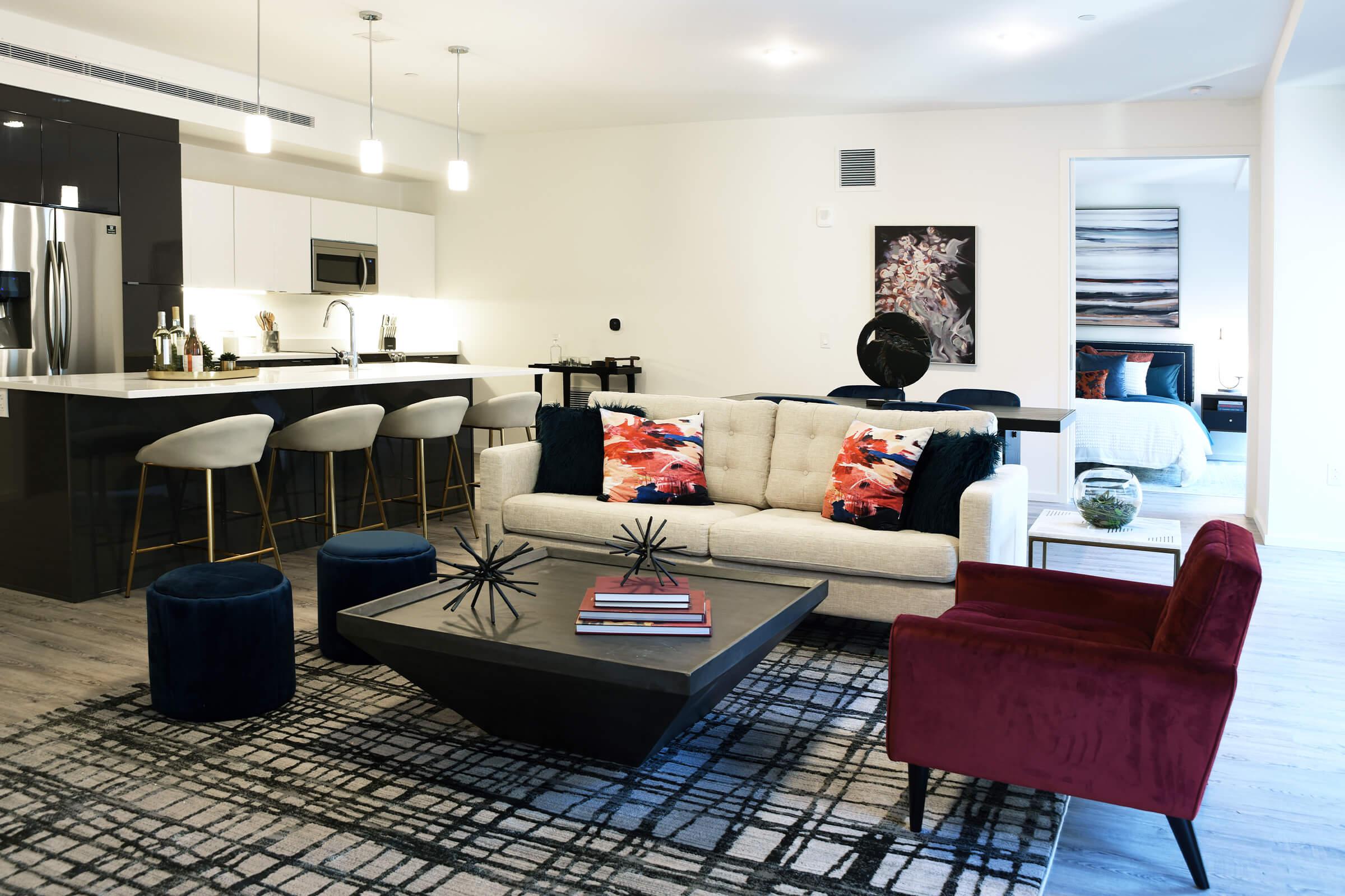 a living room filled with furniture and a table