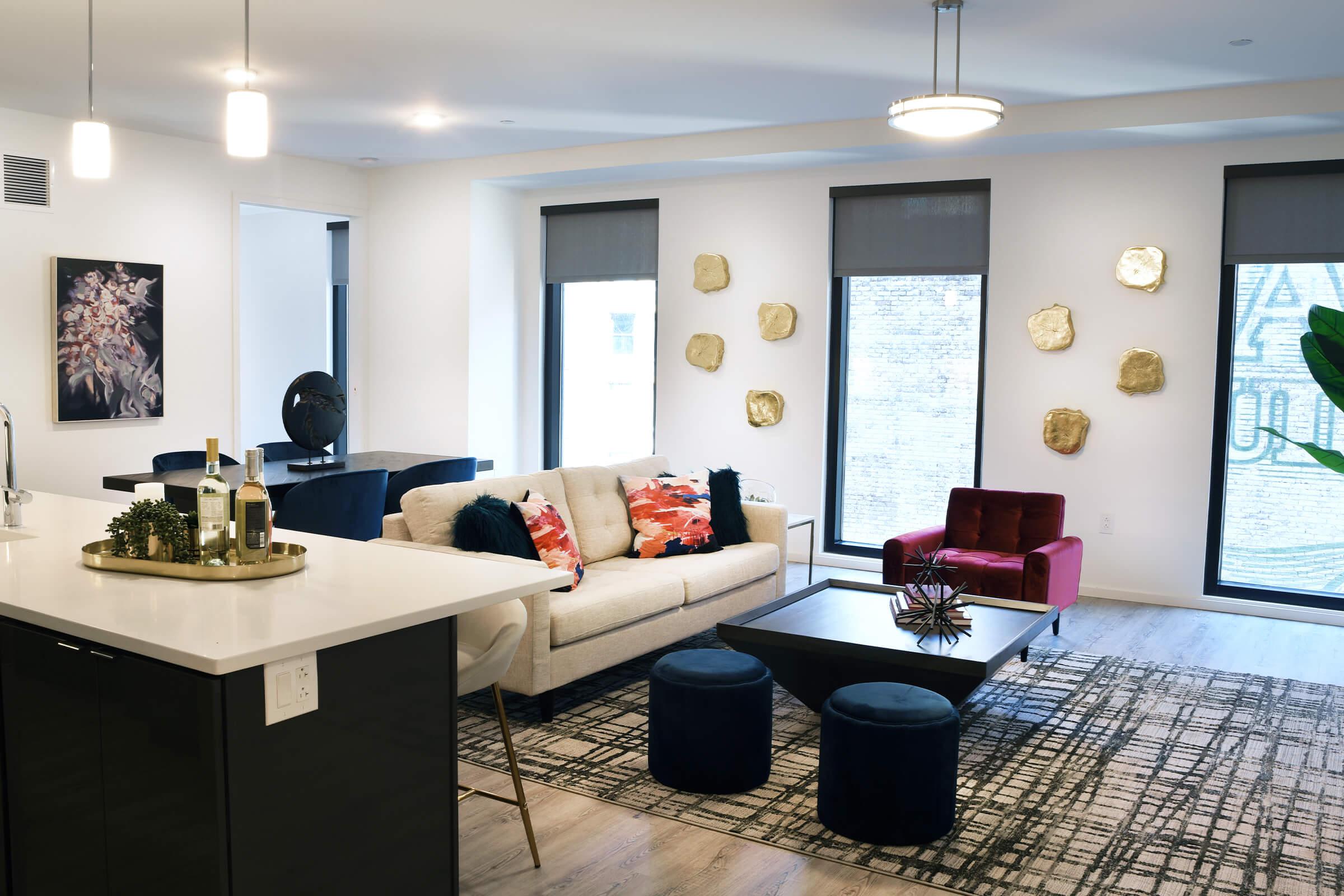 a living room filled with furniture and a flat screen tv